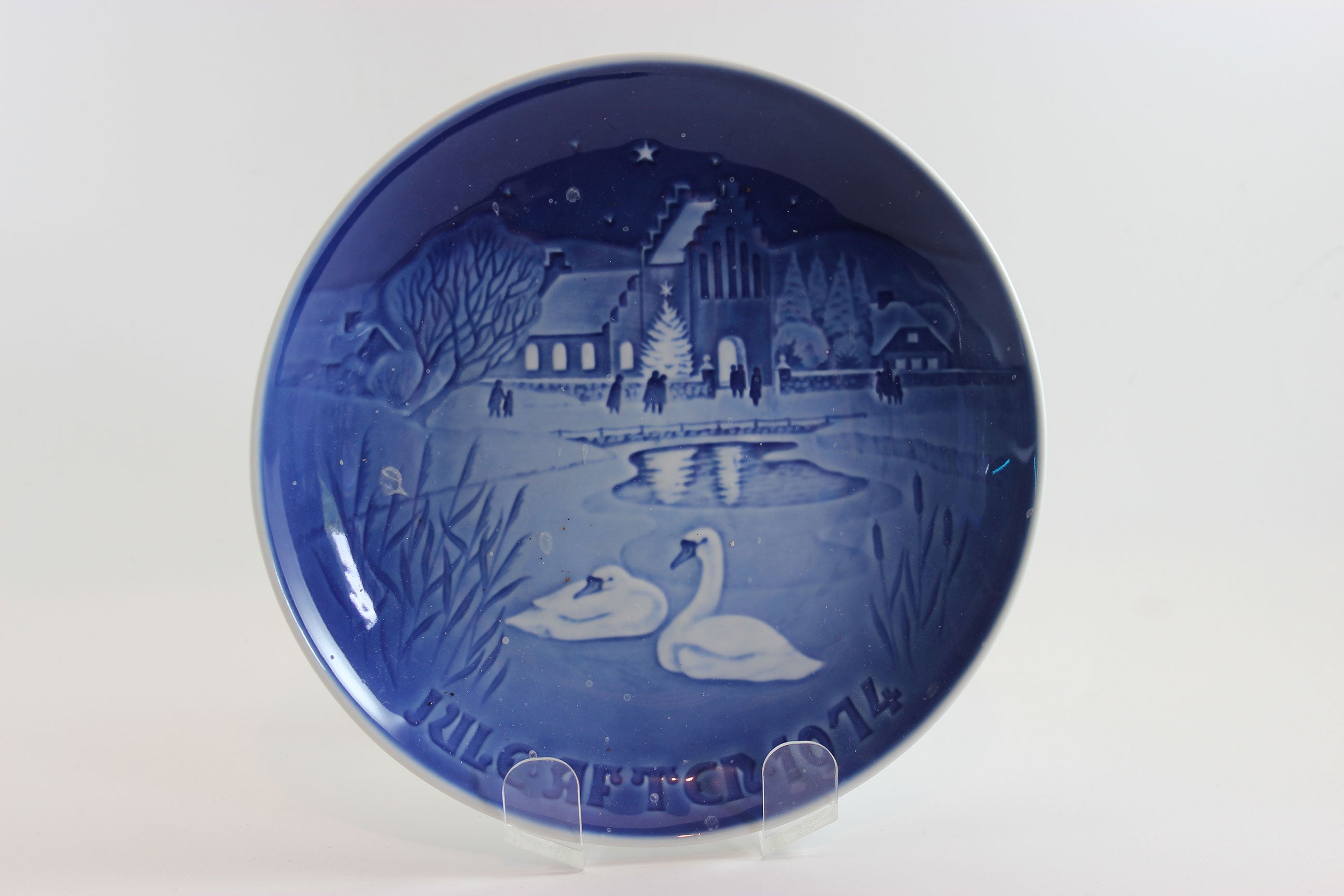 Bing and Grondahl Decorative blue plate 1974 with a winter scene featuring swans and a building.