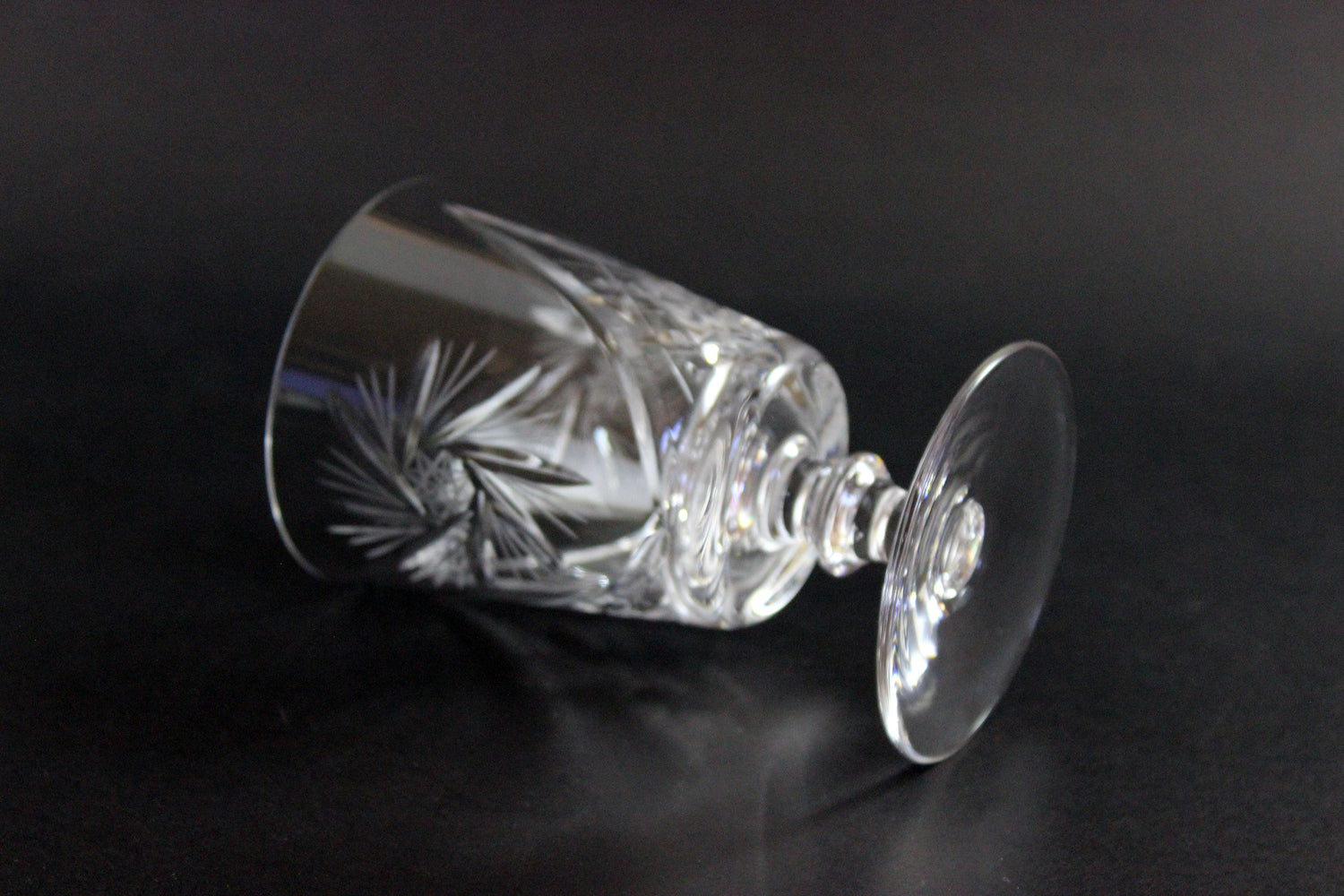 Crystal glass with cut design on a black background