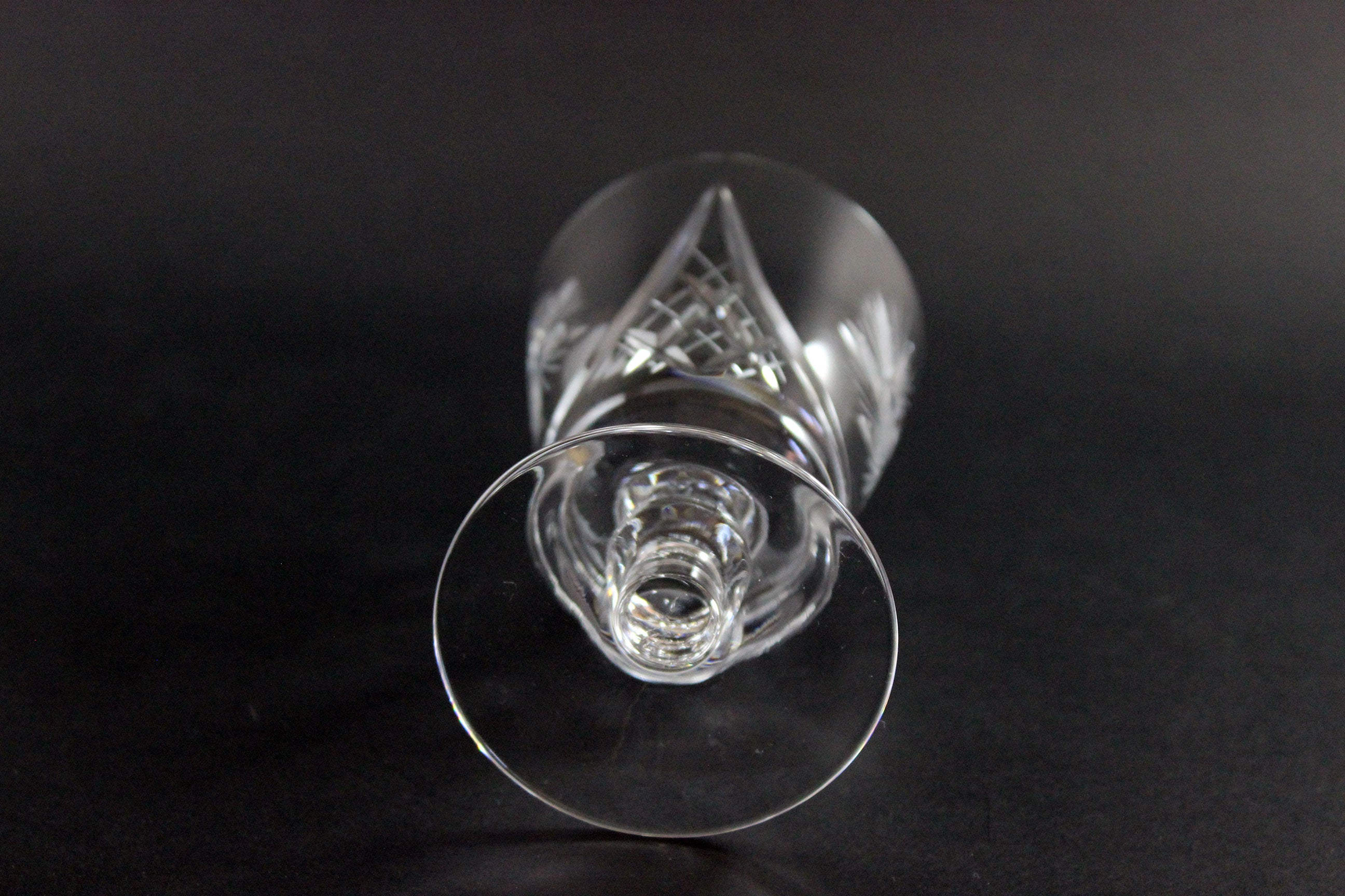 Clear crystal wine glass on a black background