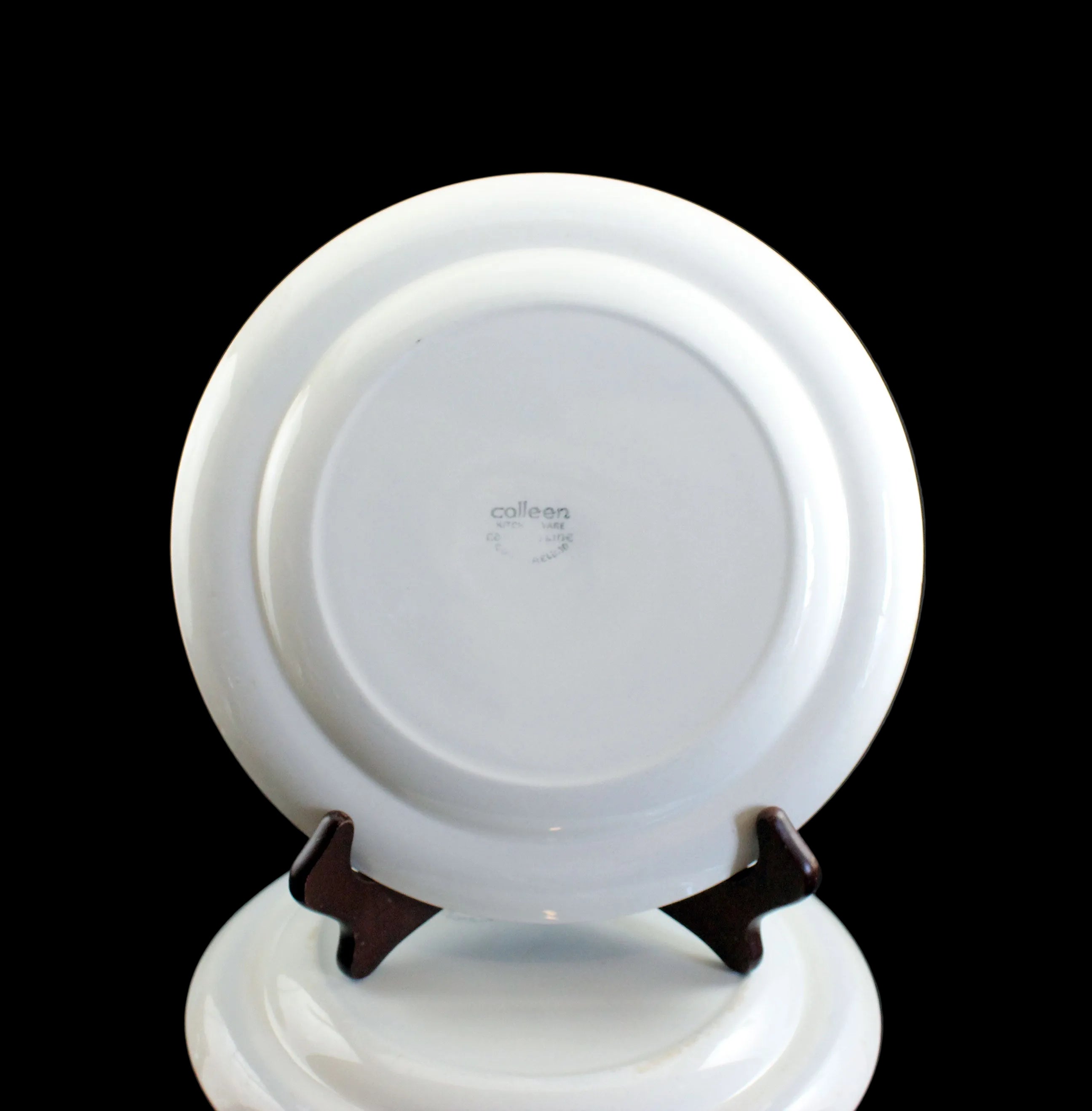 White ceramic plate on a black background
