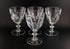 Clear, crystal Claret glasses on black background.