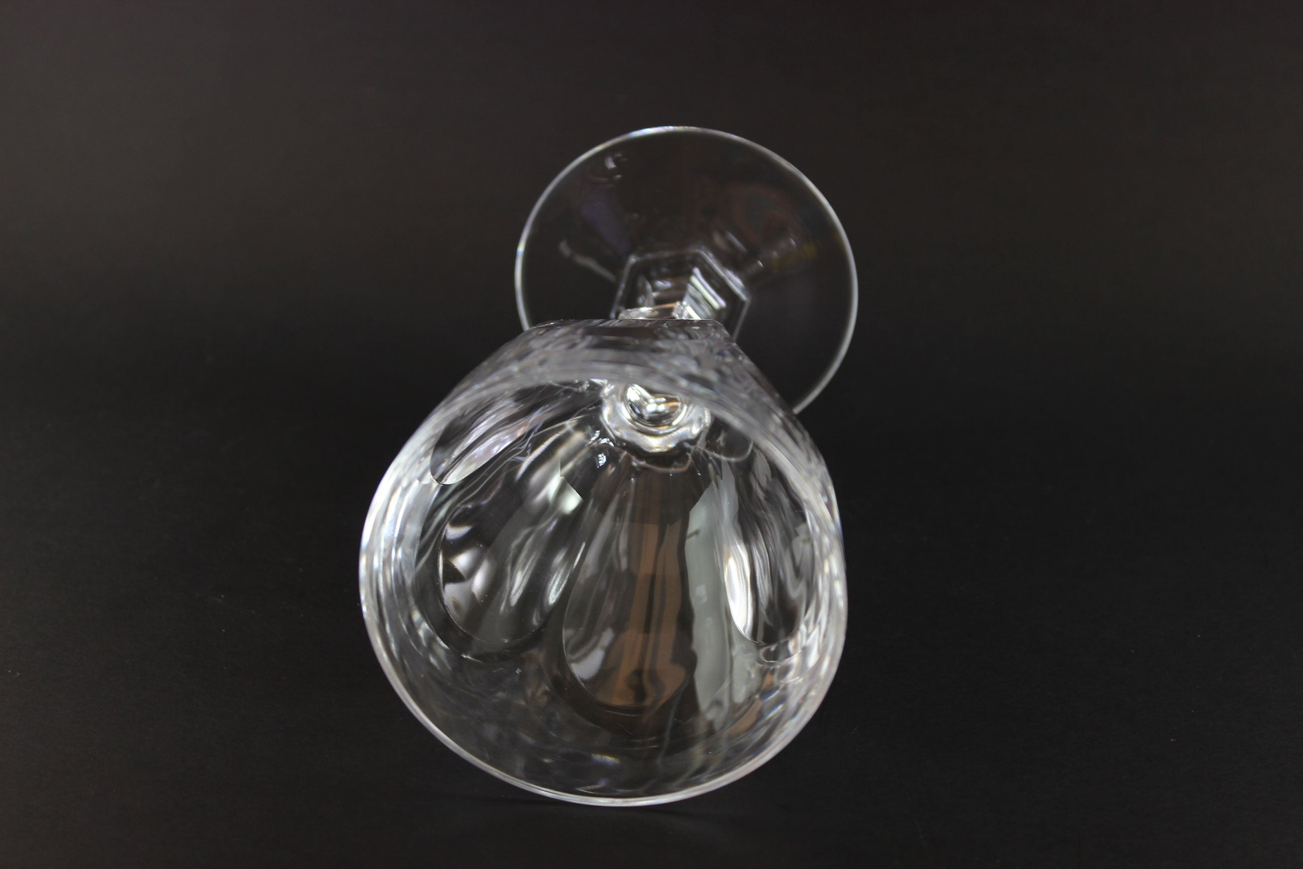 Clear crystal goblet on a black background