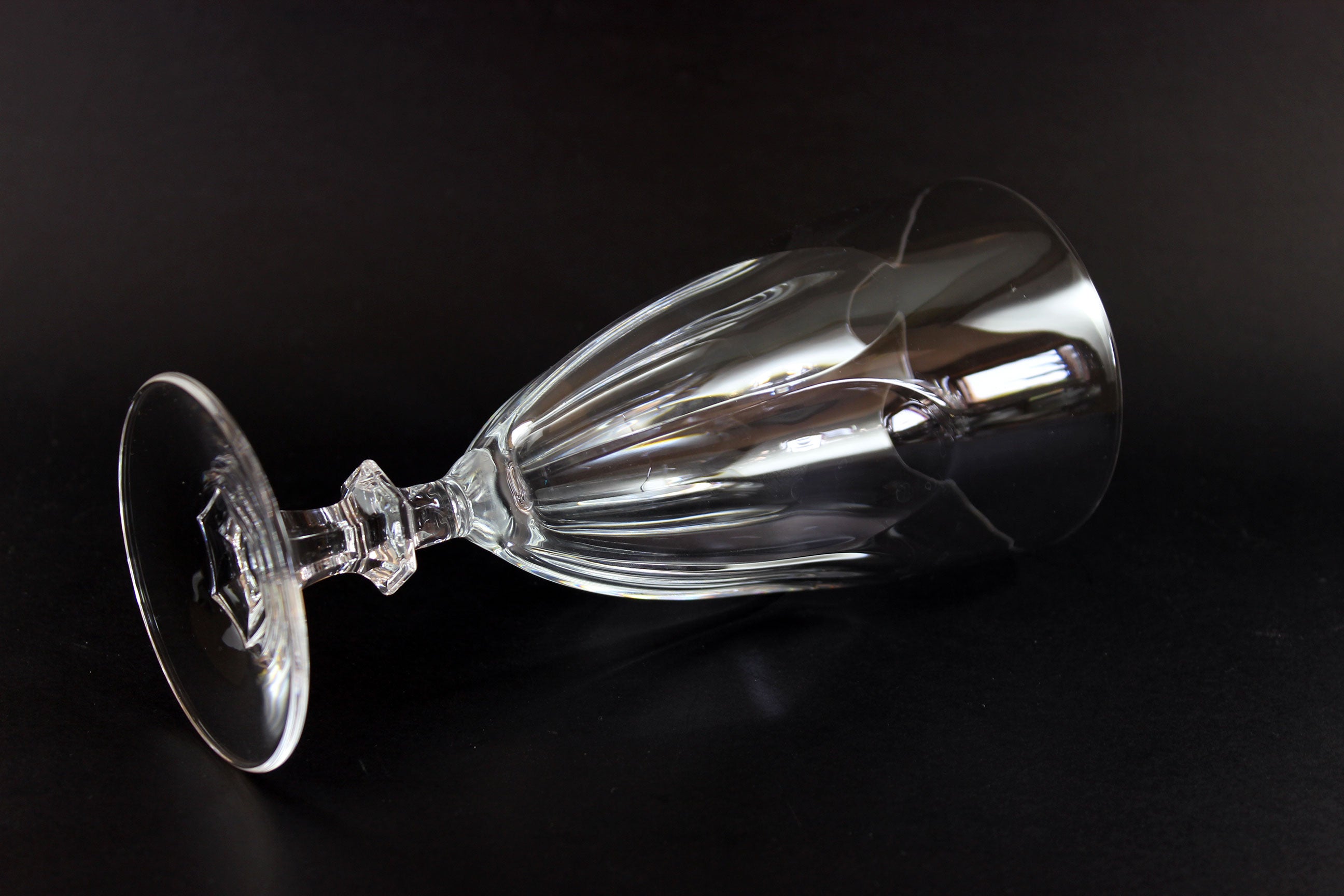Clear crystal goblet on a black background