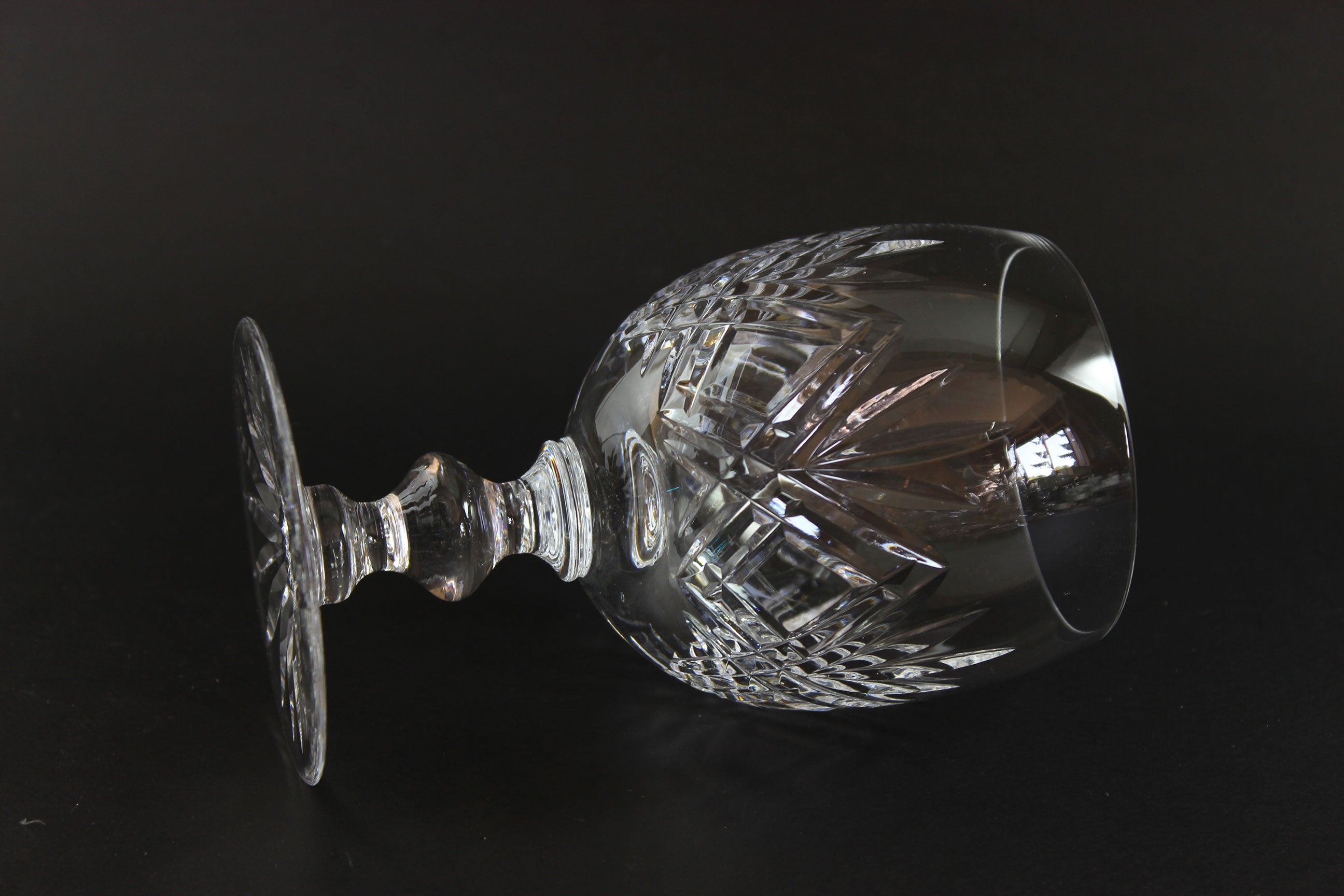 Cut crystal wine glass on a black background
