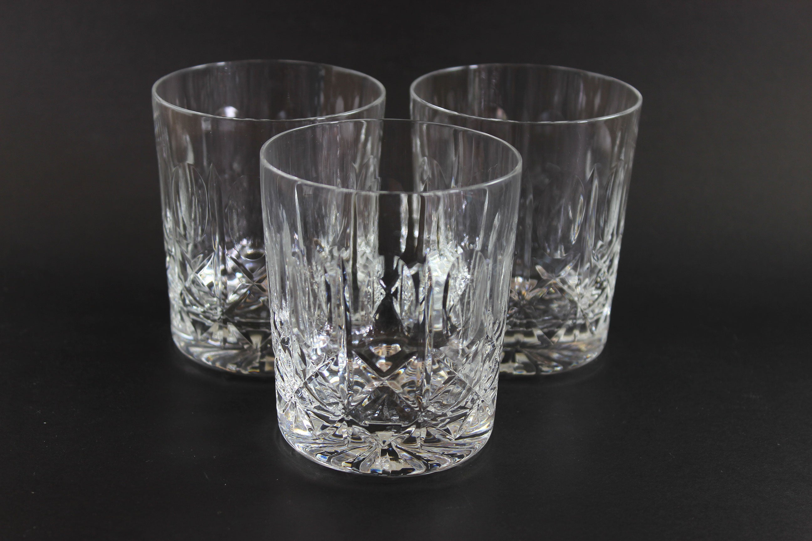 Cut Crystal Whiskey Glass on Black Background