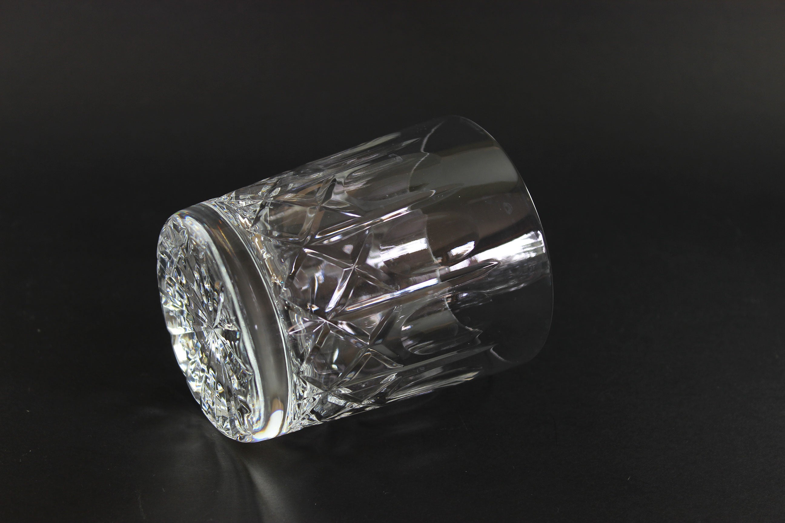 Cut Crystal Whiskey Glass on Black Background