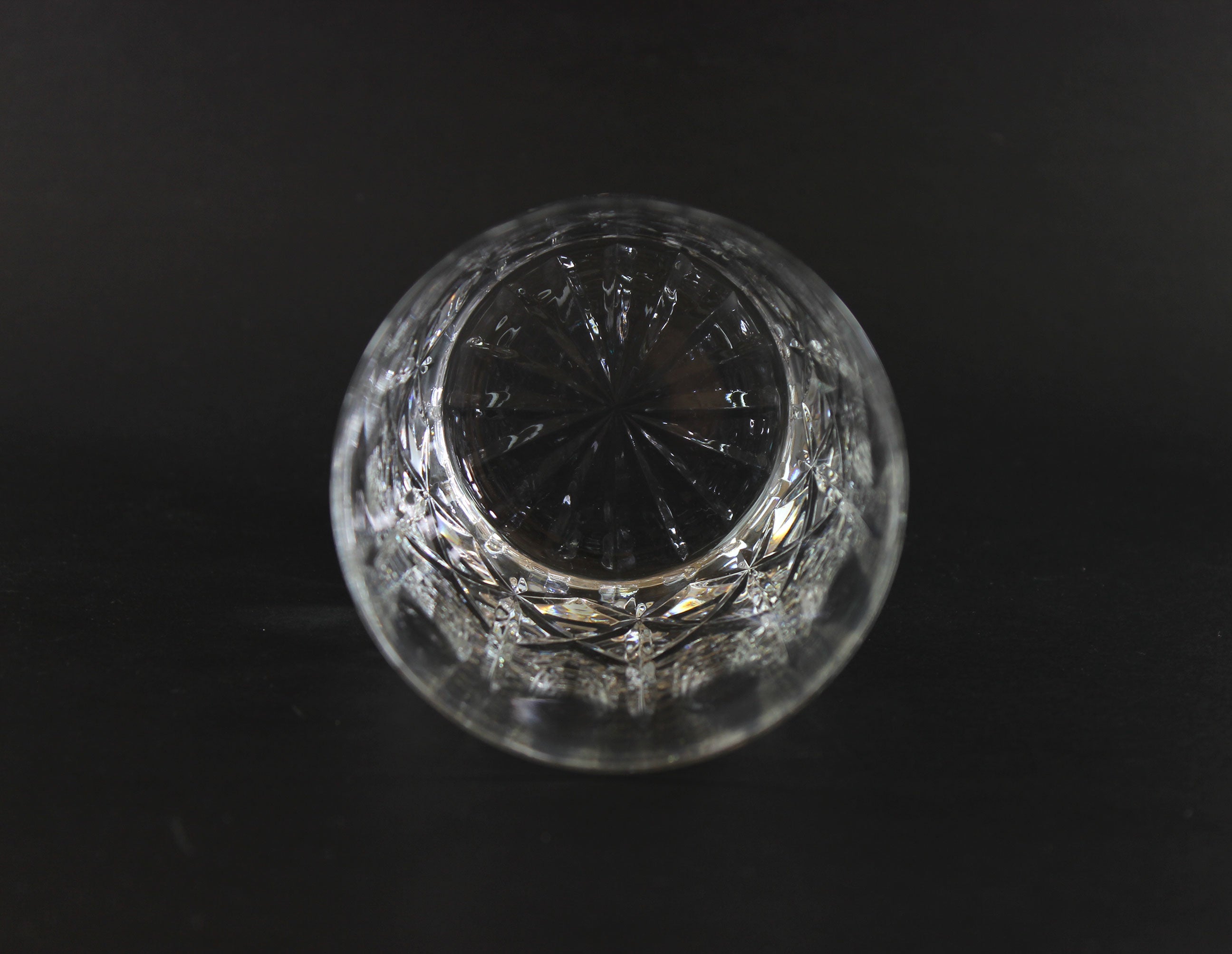 Cut Crystal Whiskey Glass on Black Background