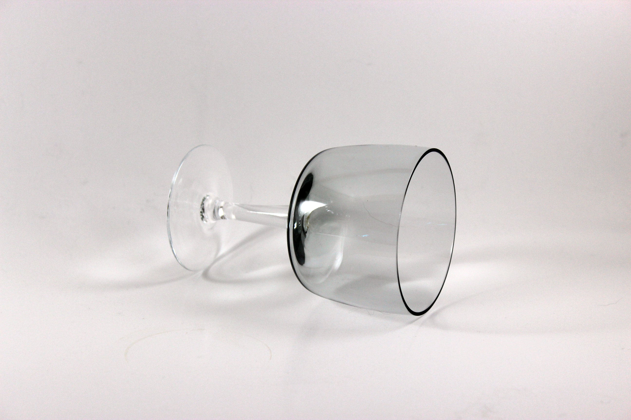 Set of smoked glass port glasses on a white background