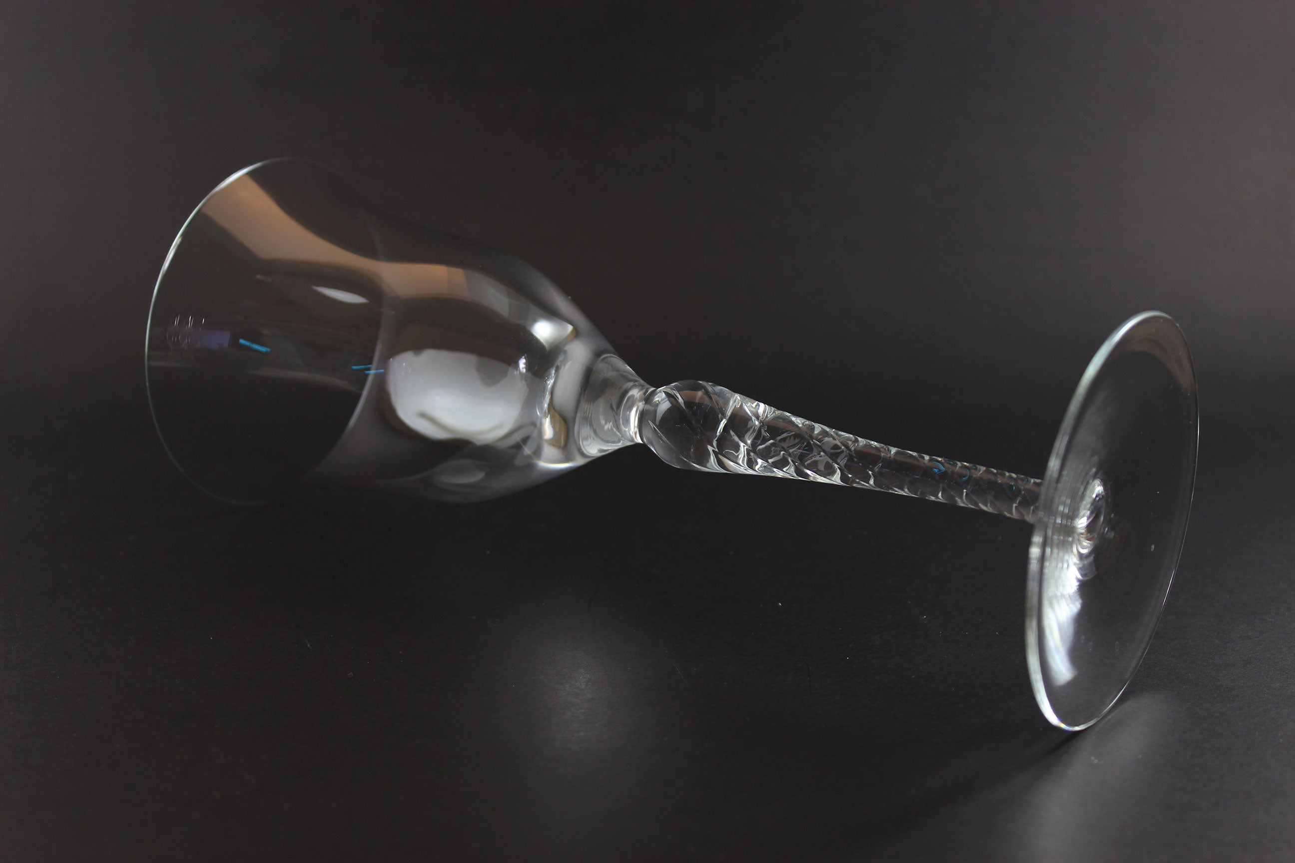 Clear glass goblet on a dark background