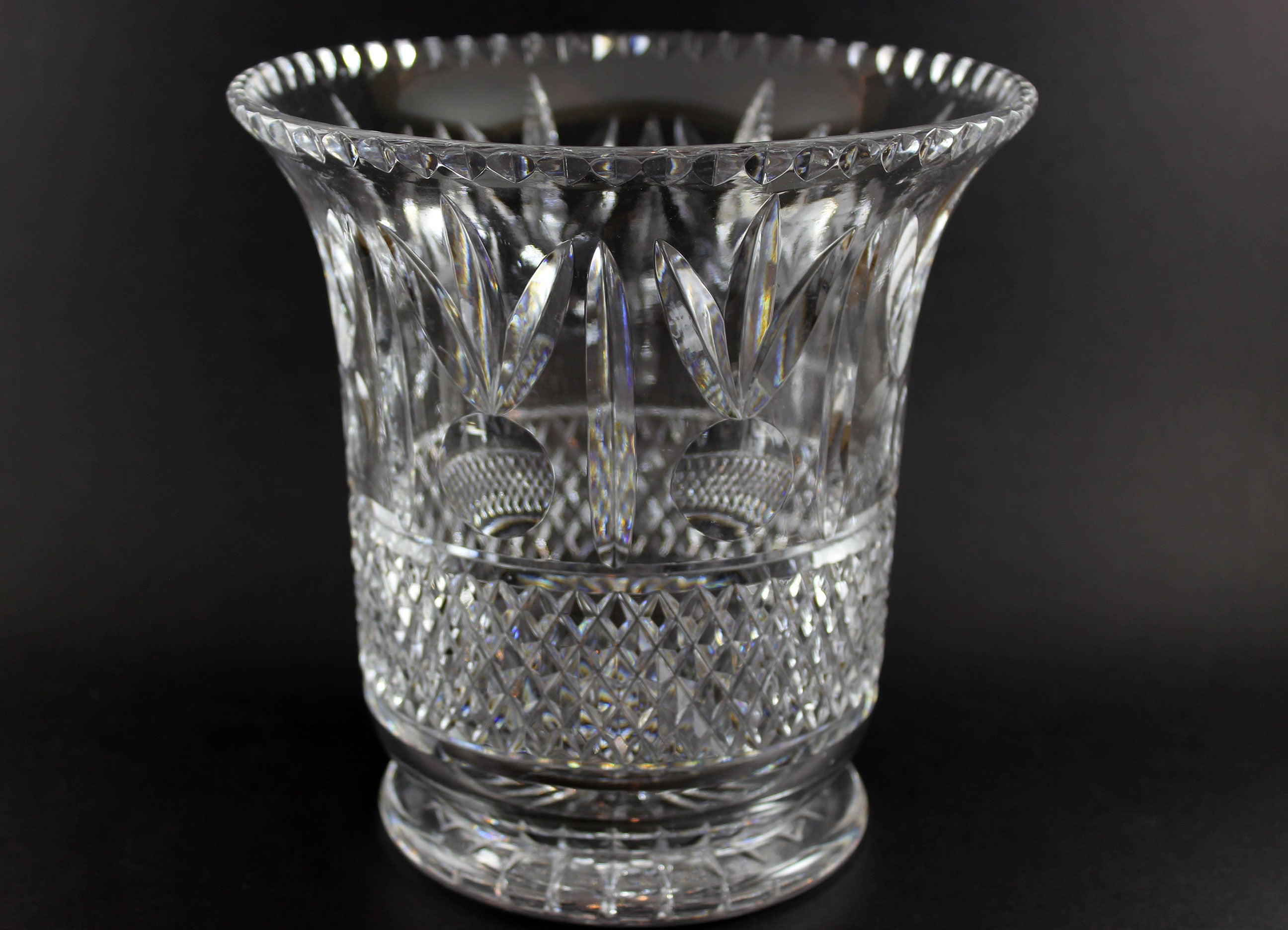 Large Crystal vase or bowl with intricate cut patterns on a black background