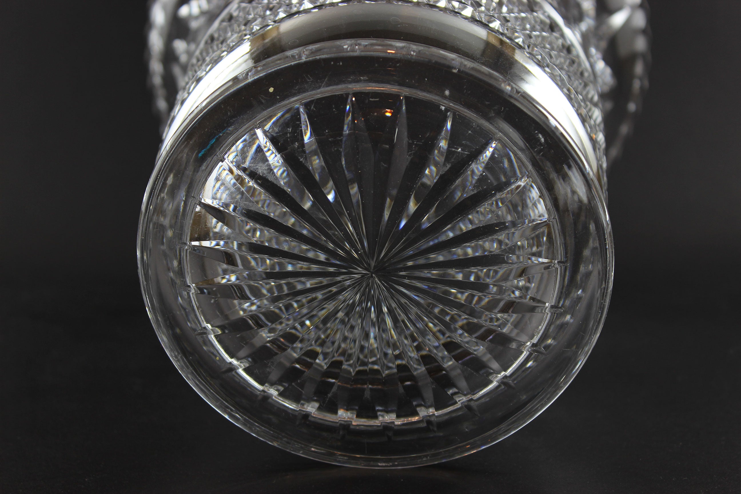 Large Crystal vase or bowl with intricate cut patterns on a black background