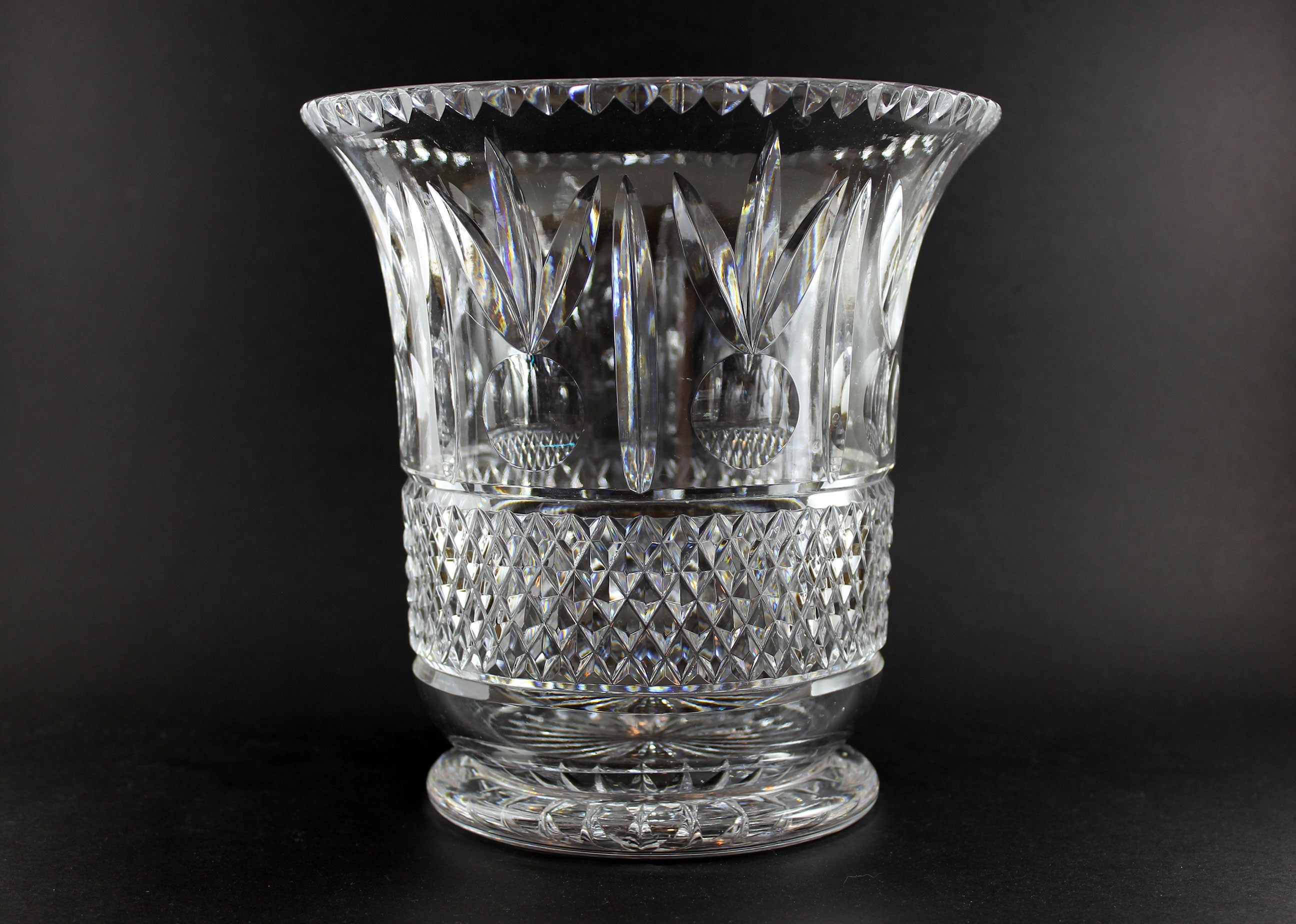 Large Crystal vase or bowl with intricate cut patterns on a black background
