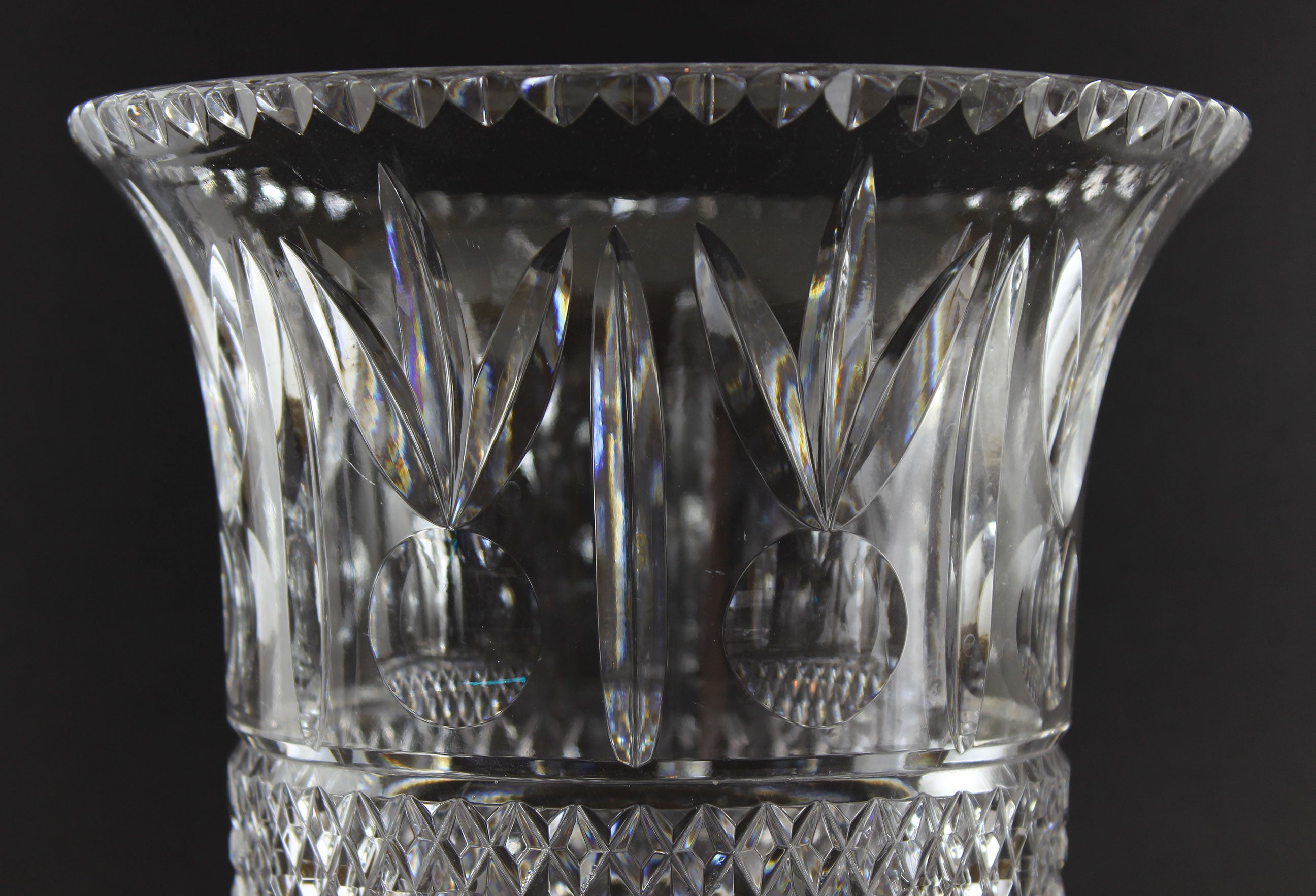 Large Crystal vase or bowl with intricate cut patterns on a black background