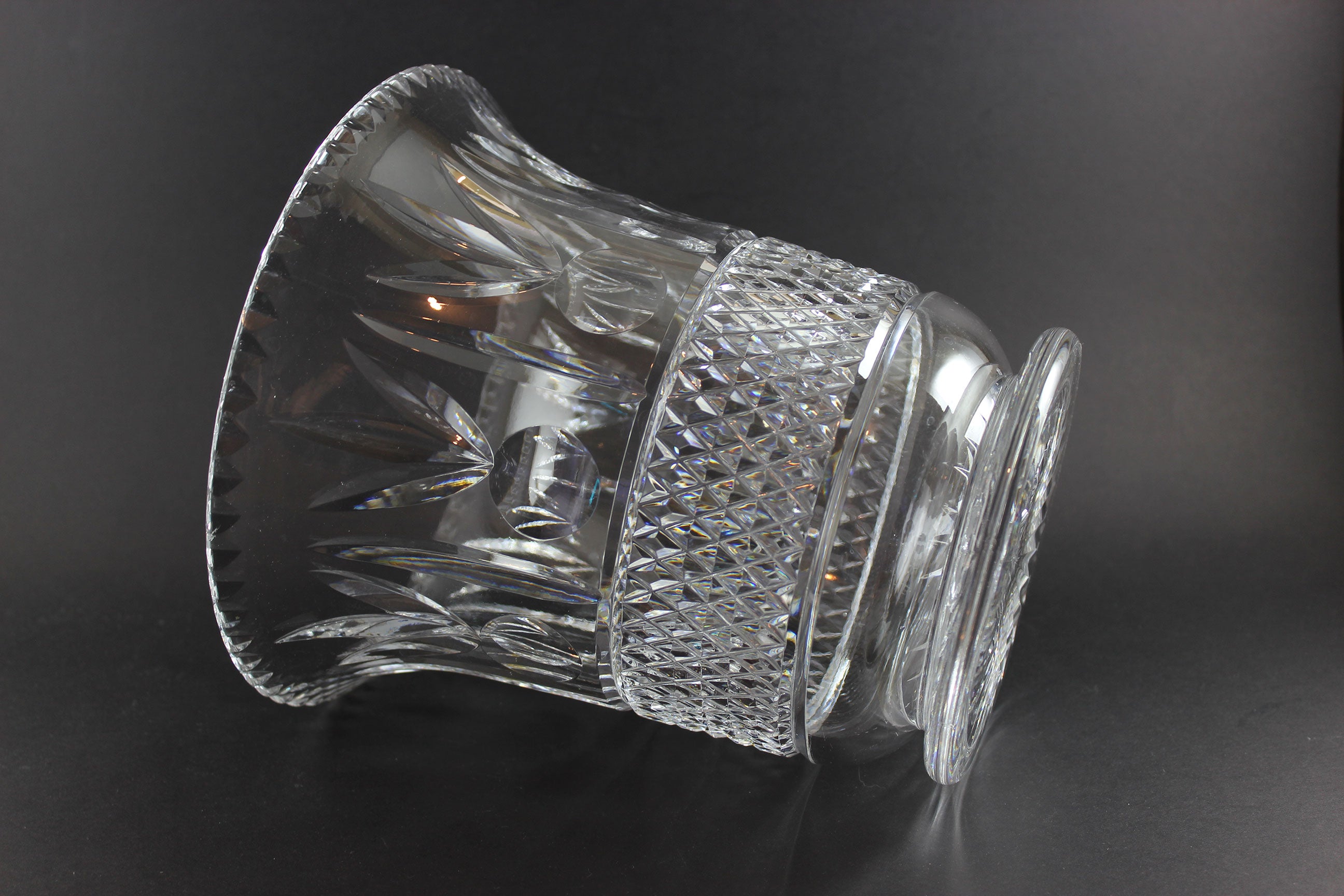 Large Crystal vase or bowl with intricate cut patterns on a black background