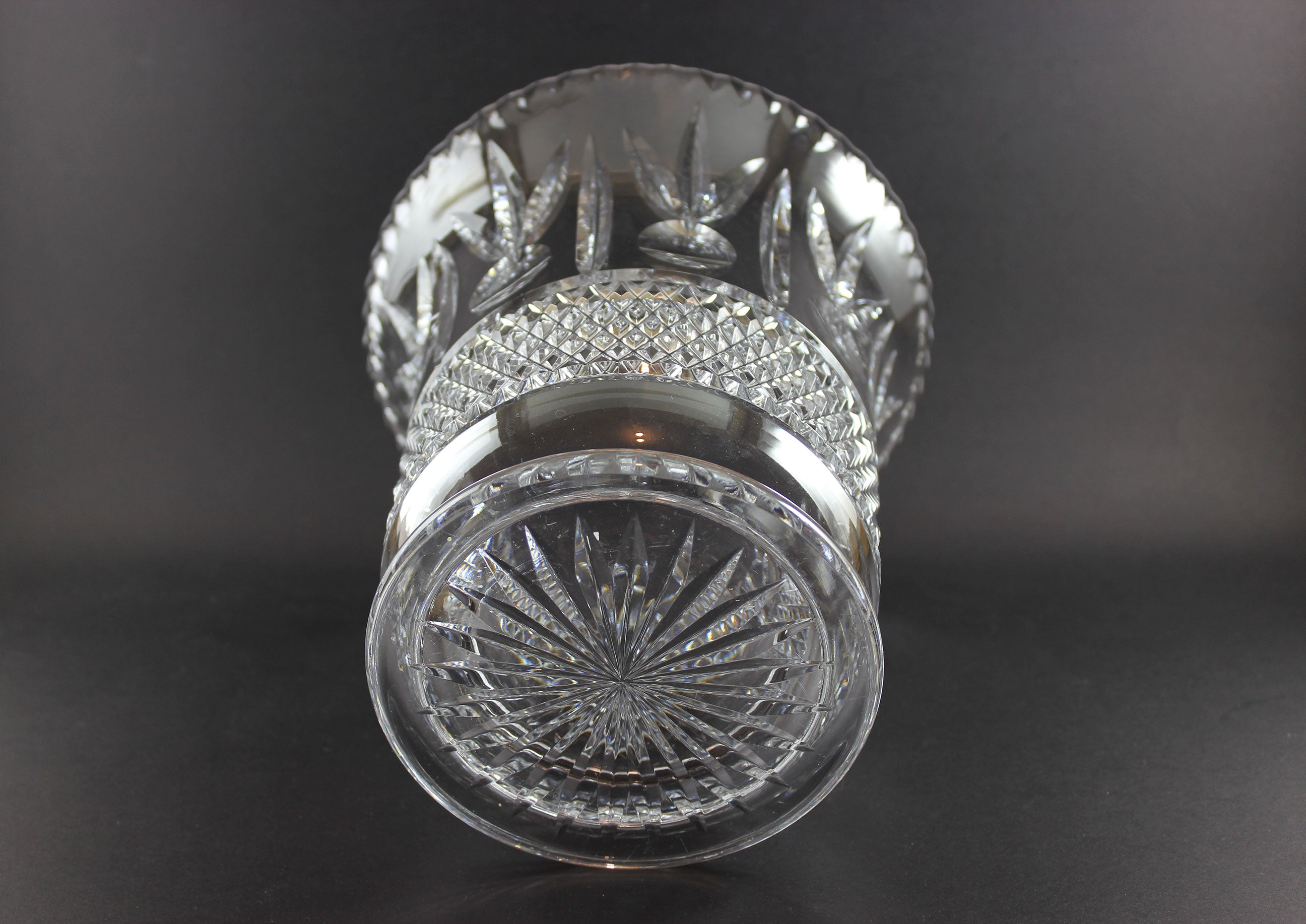 Large Crystal vase or bowl with intricate cut patterns on a black background