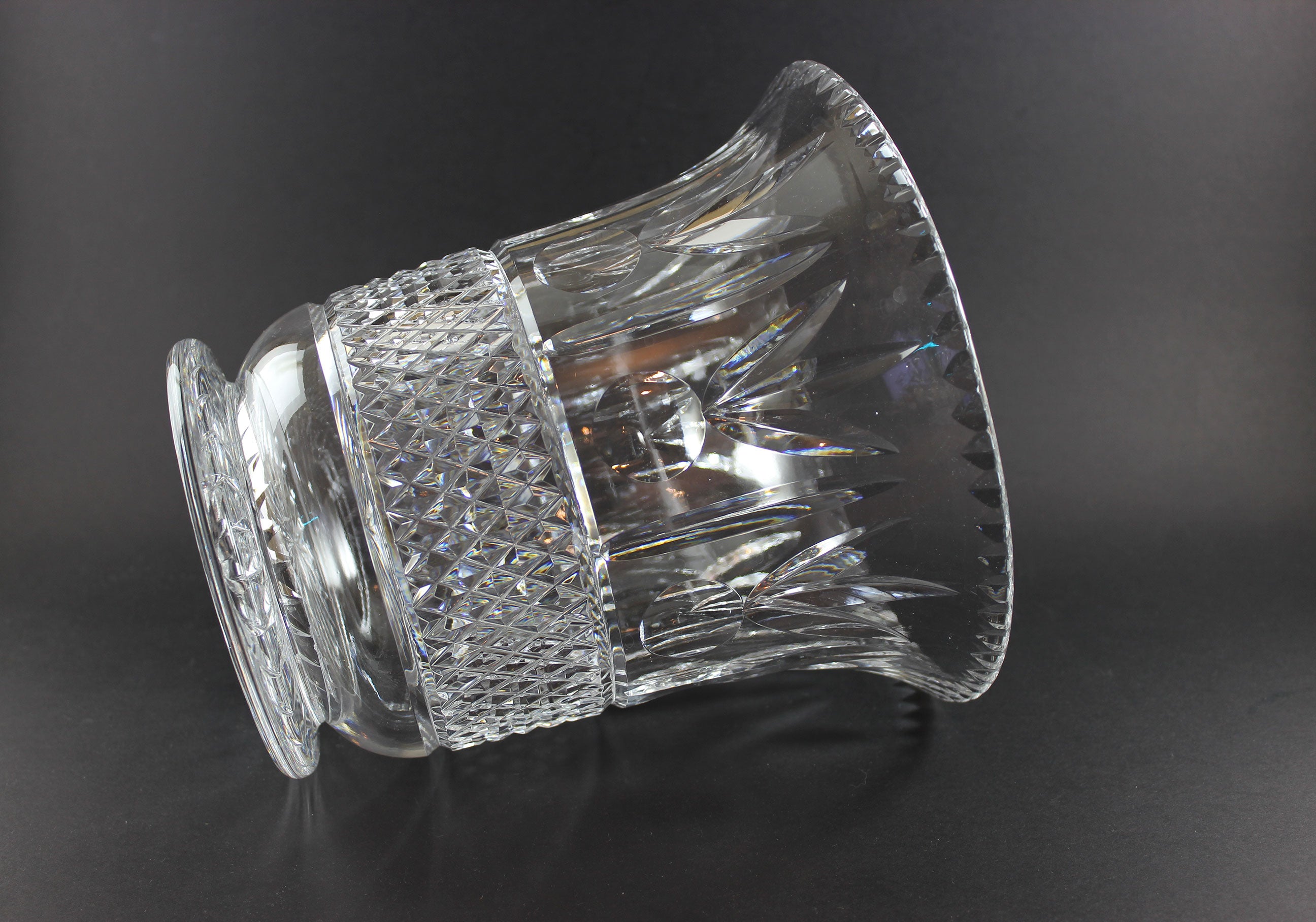 Large Crystal vase or bowl with intricate cut patterns on a black background