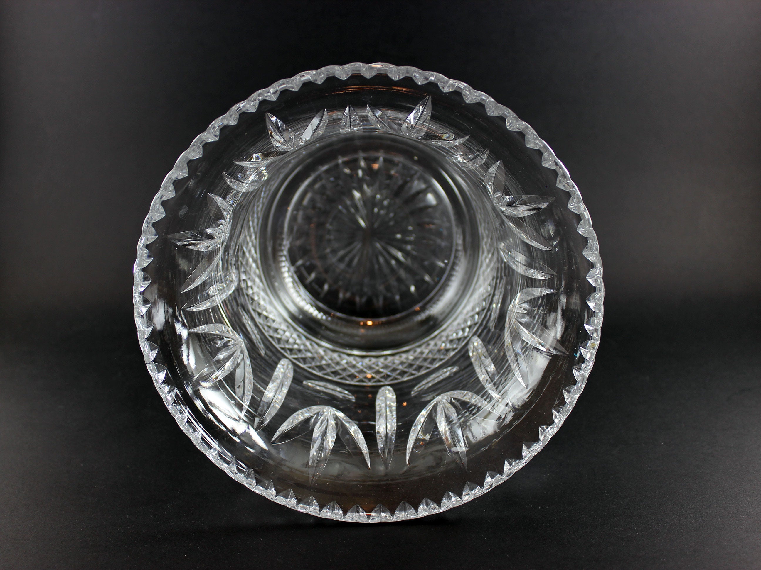 Large Crystal vase or bowl with intricate cut patterns on a black background