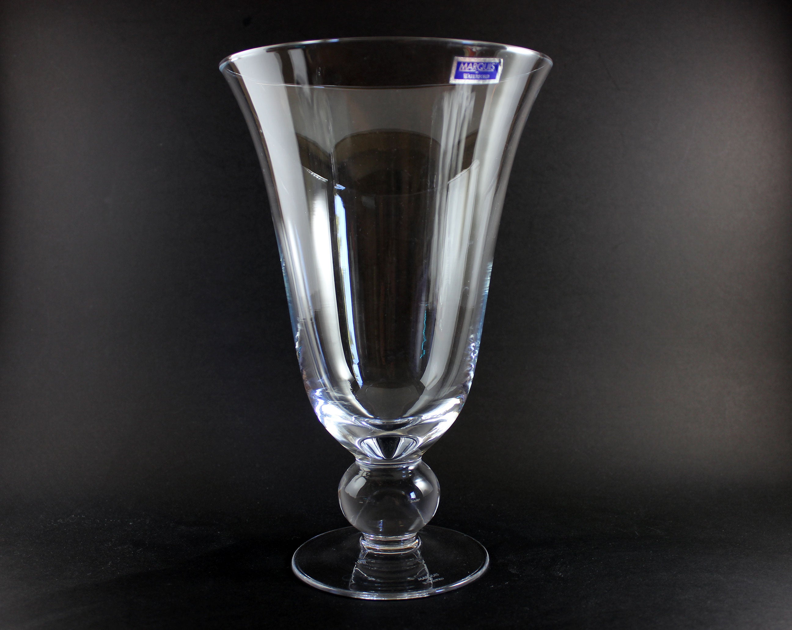Clear Waterford crystal vase on a black background
