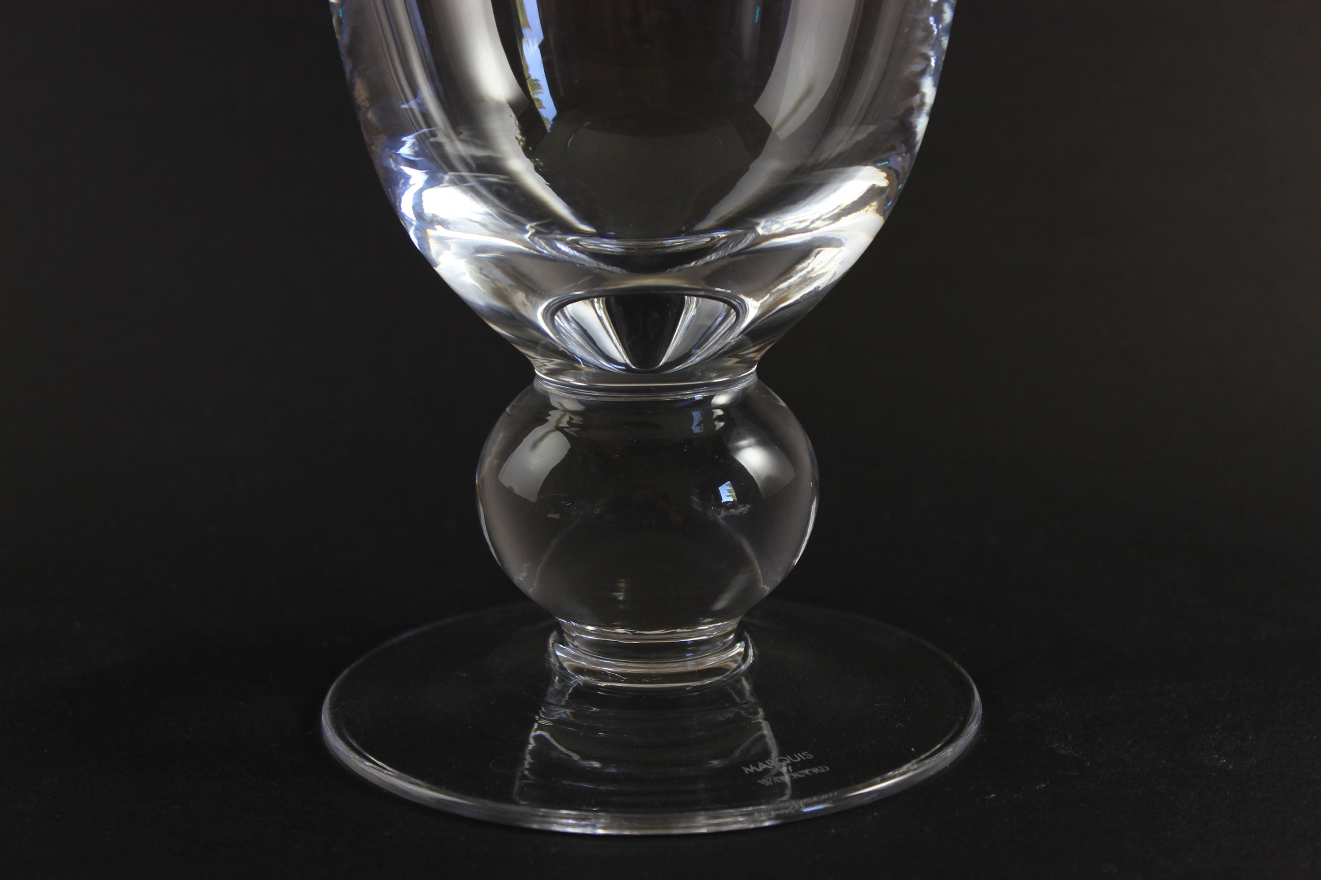 Clear Waterford crystal vase on a black background