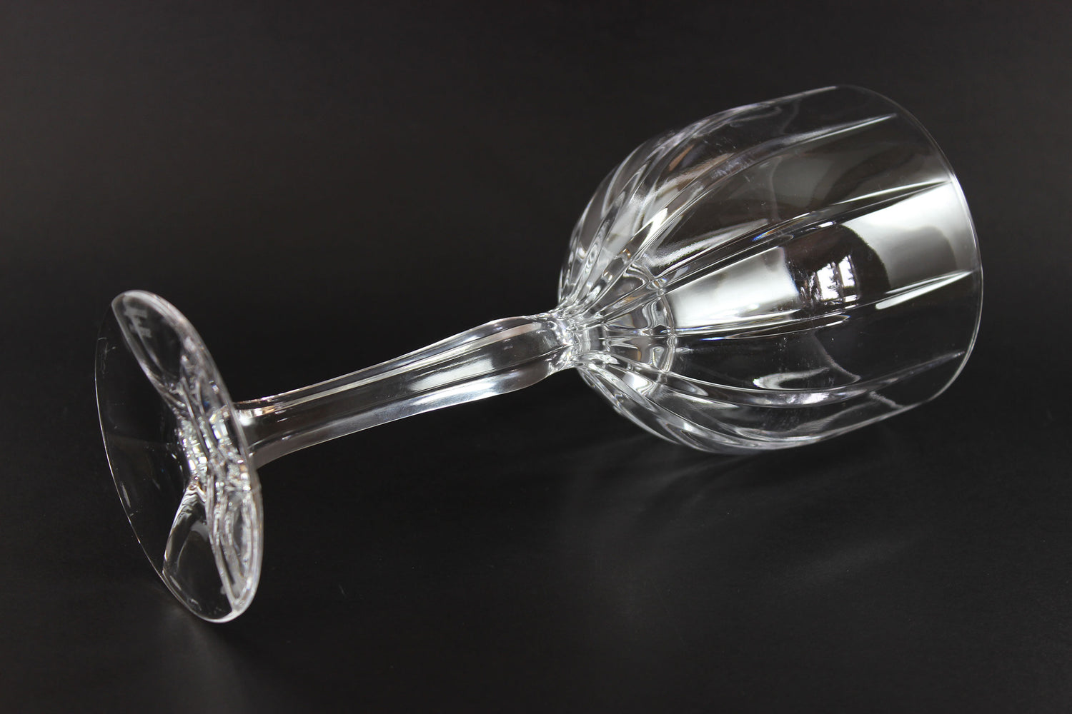 Clear wine glass on a black background