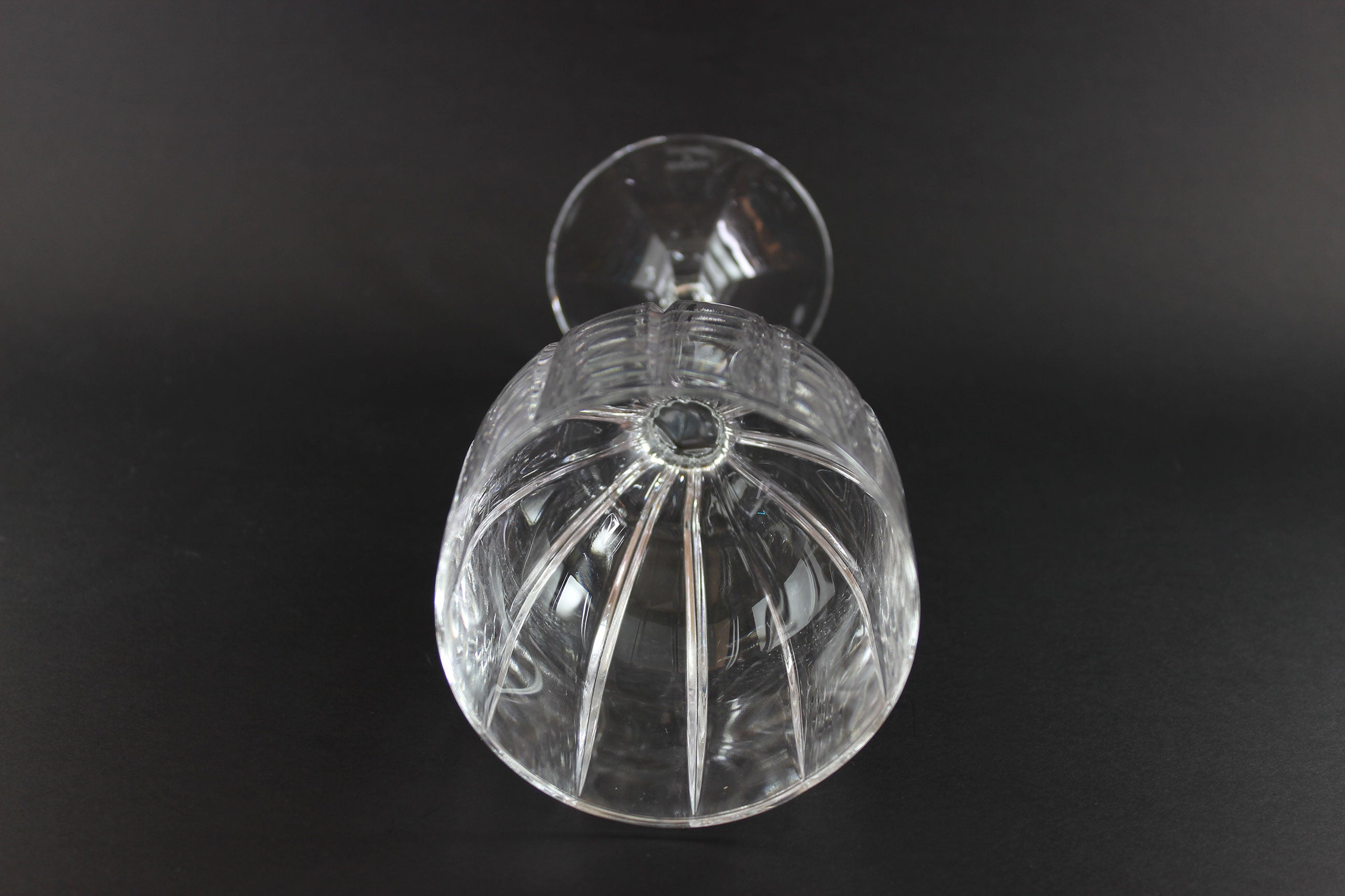 Clear glass object on a black background