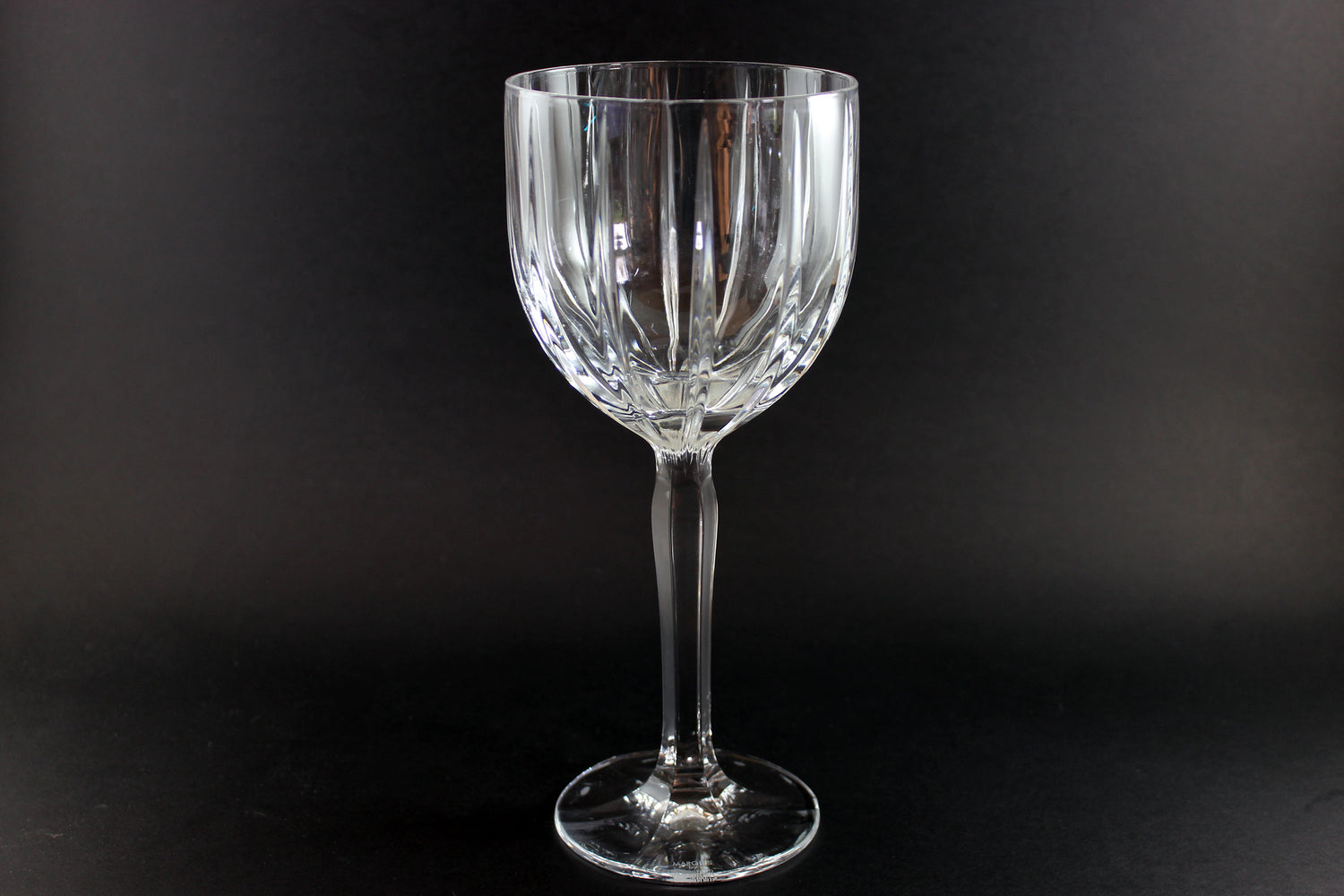 Clear glass wine glass on a black background