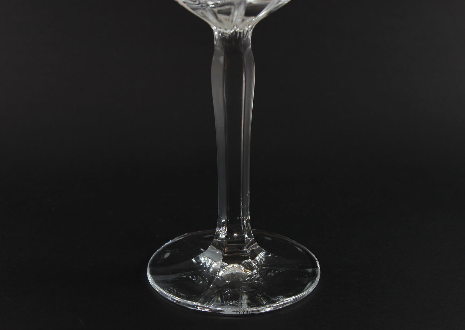 Clear glass stemware on a black background