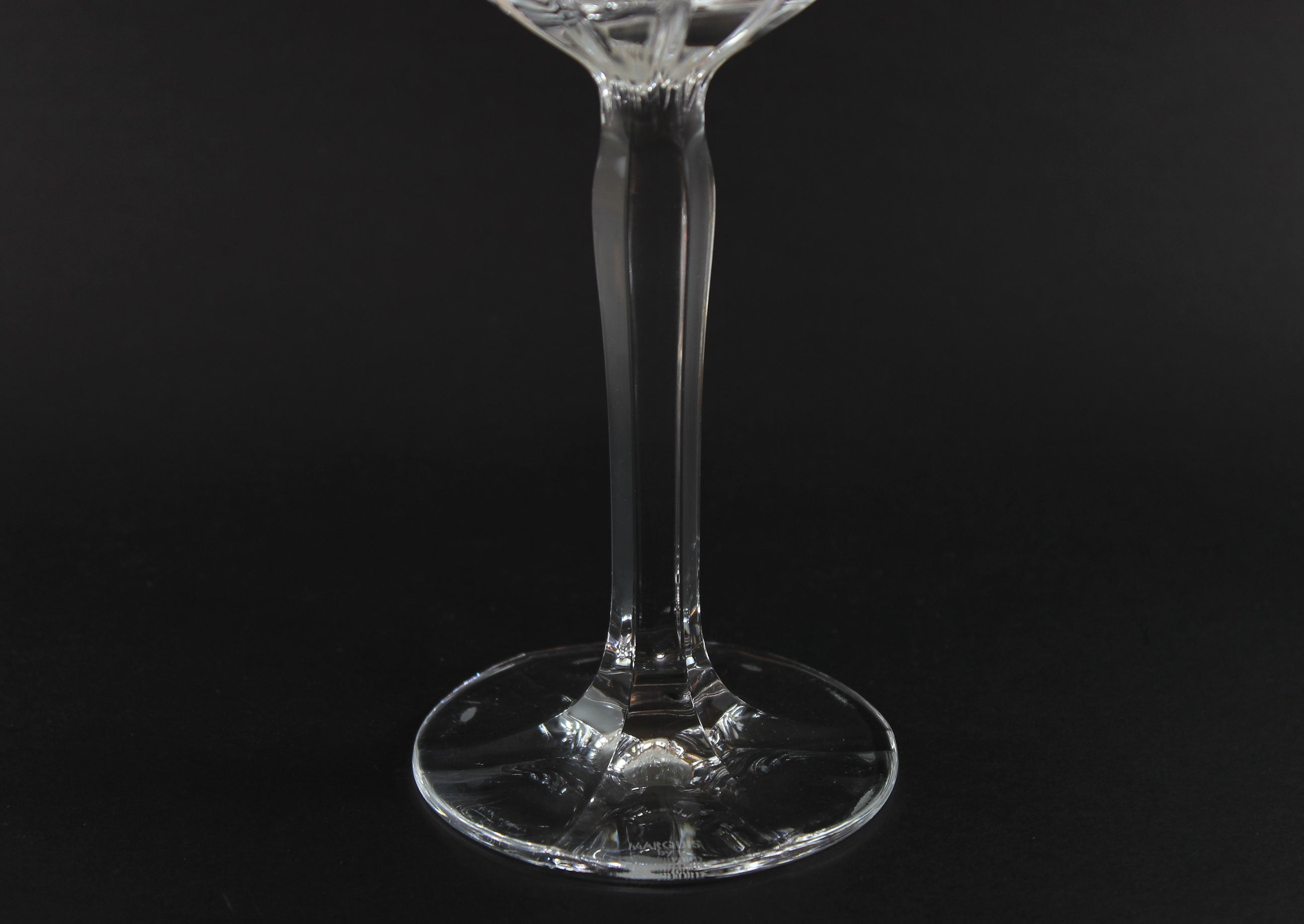 Clear glass stemware on a black background