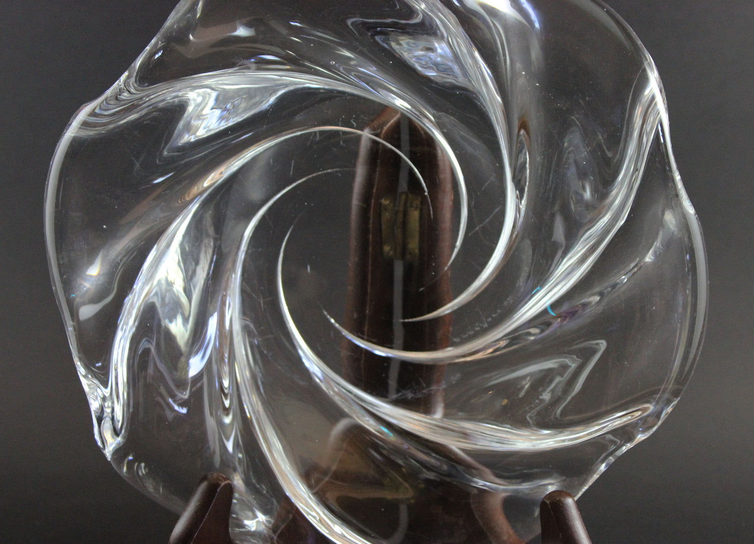 Clear crystal bowl with wavy design on a black background