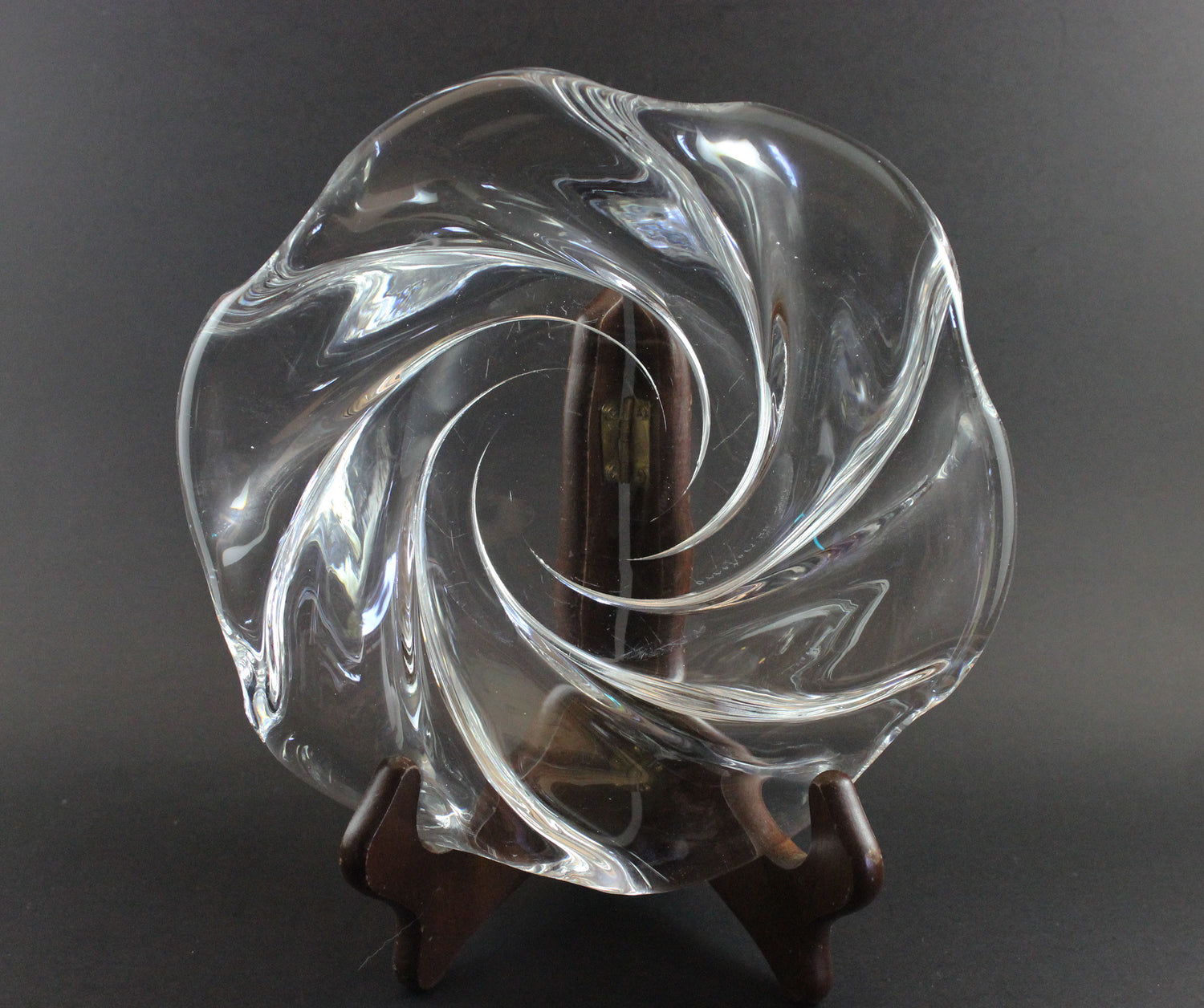 Clear crystal bowl with wavy design on a black background