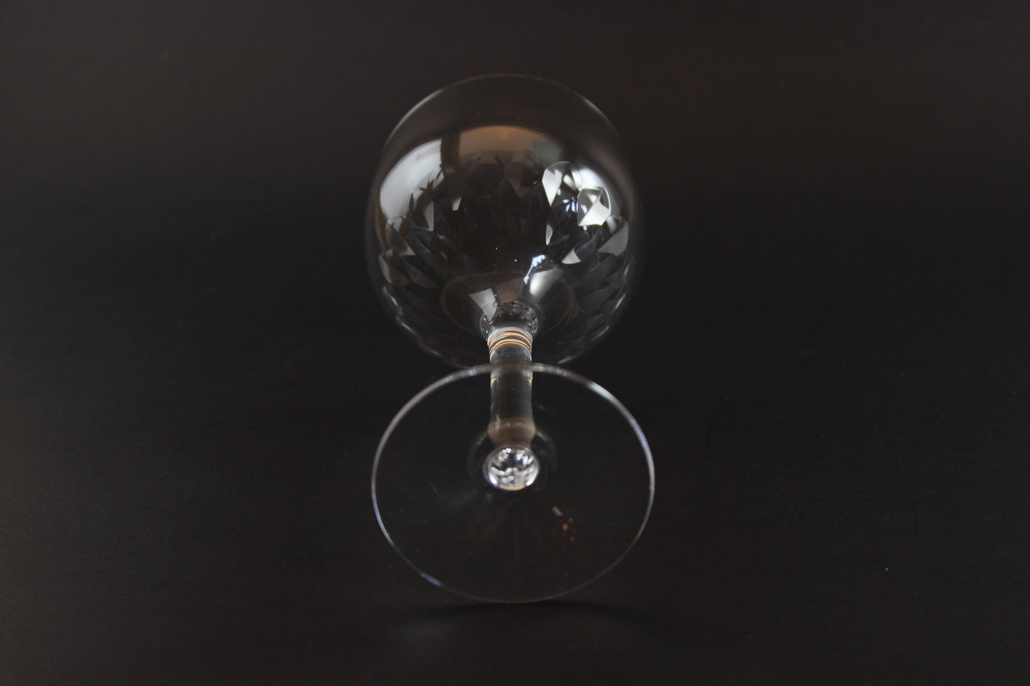 Set of six clear Orrefors Prelude wine glasses on a dark background