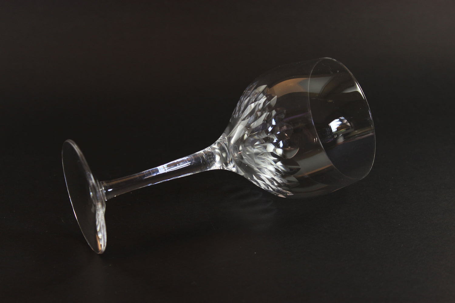 Set of six clear Orrefors Prelude wine glasses on a dark background