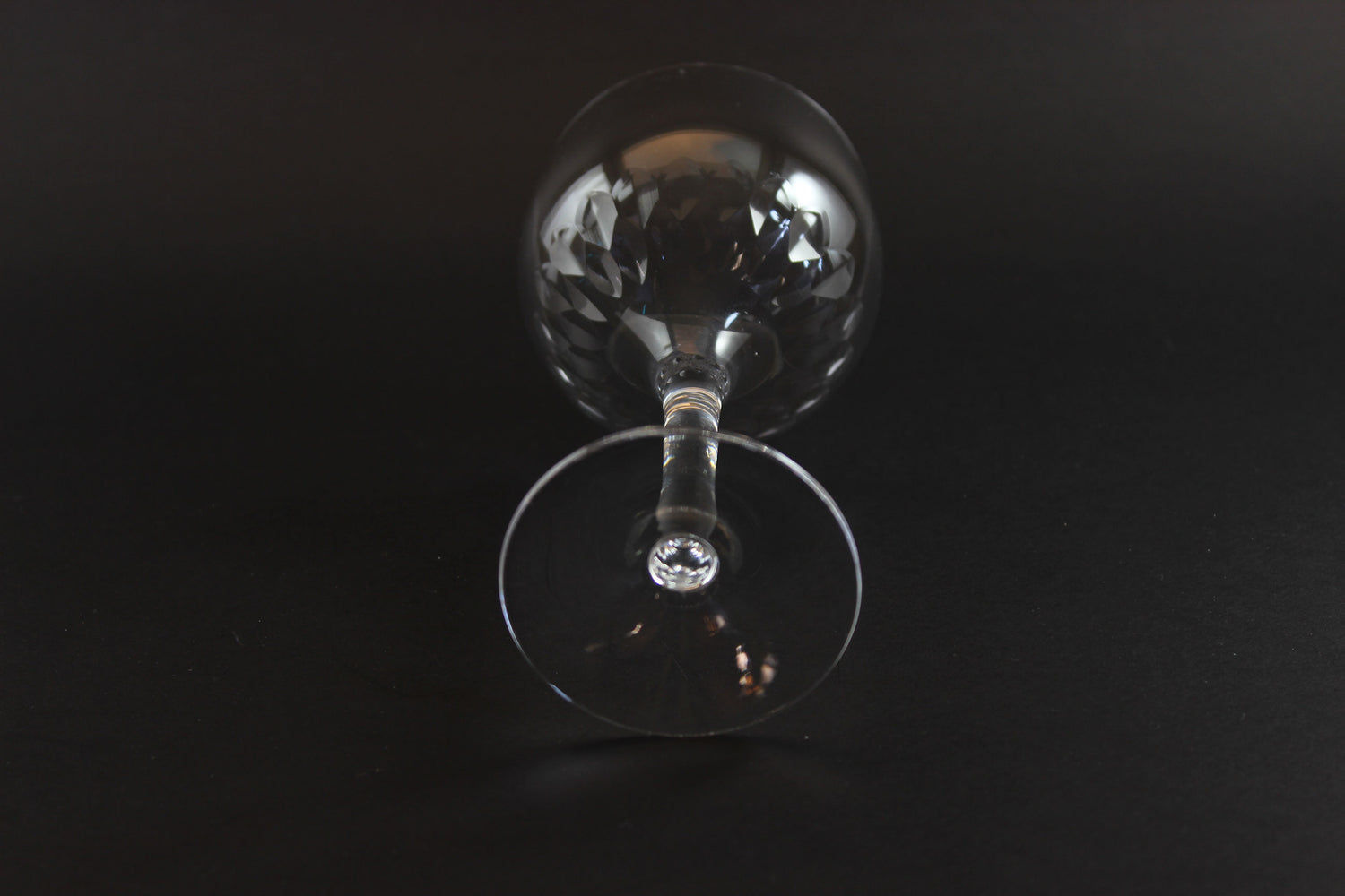 Set of six clear Orrefors Prelude wine glasses on a dark background