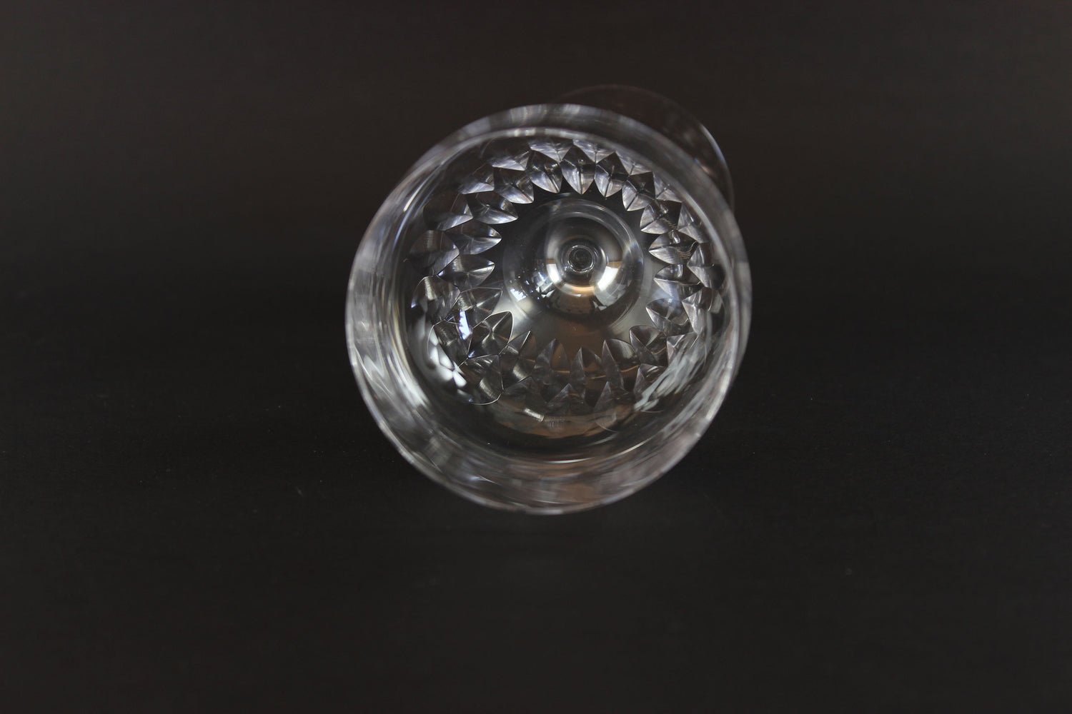 Set of six clear Orrefors Prelude wine glasses on a dark background