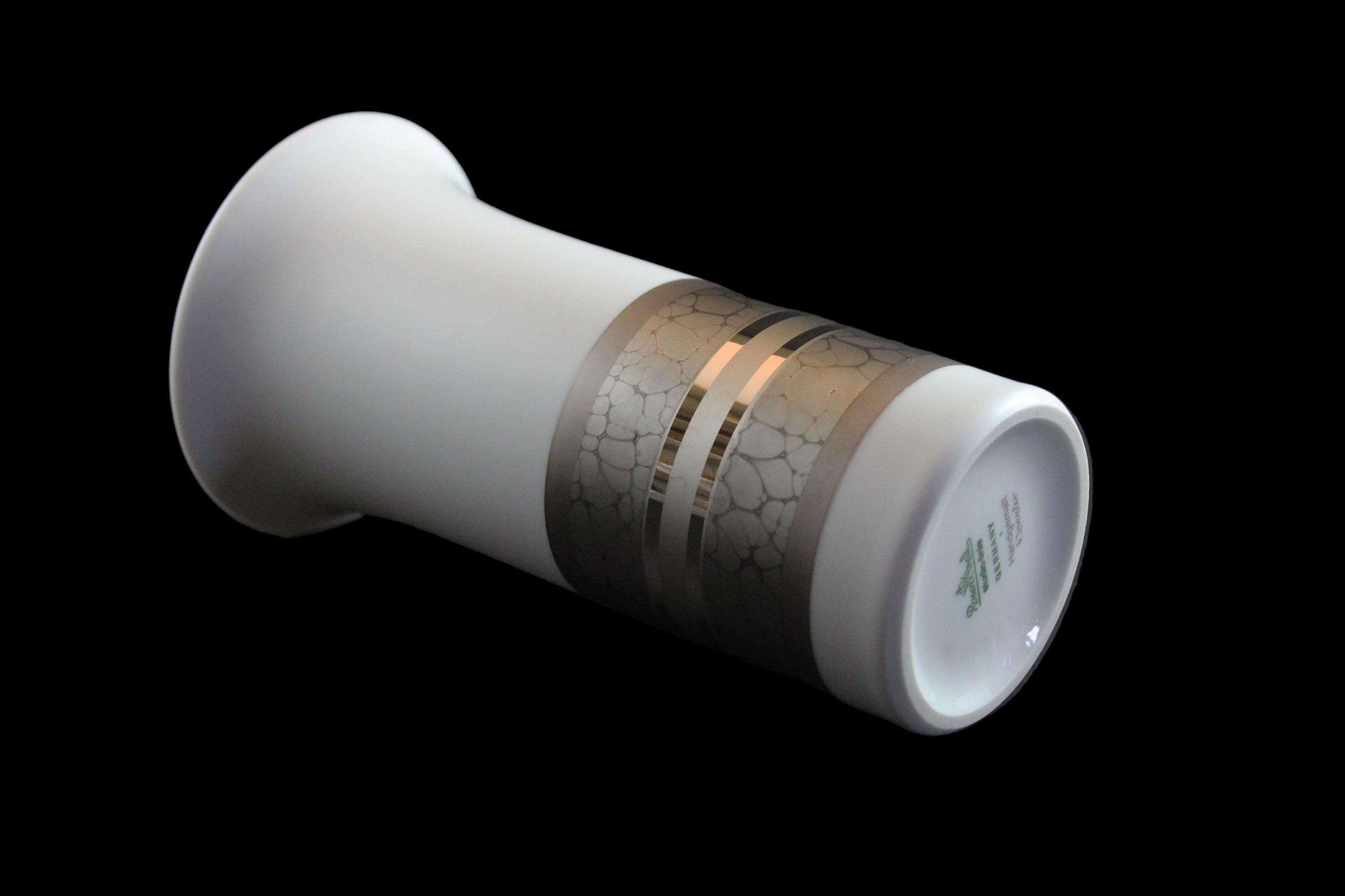 White porcelain Rosenthal vase with platinum and gold embellishments.