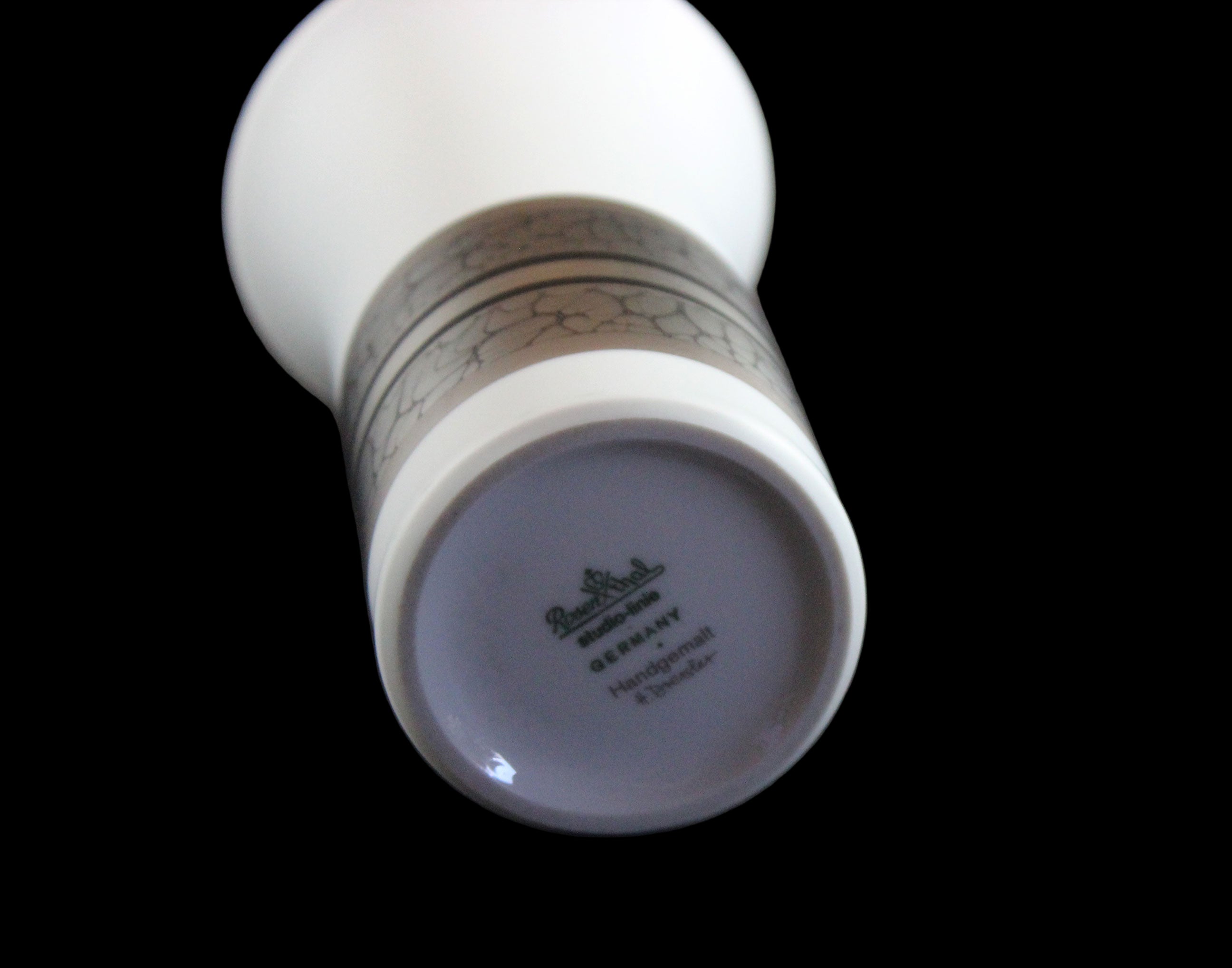 White porcelain Rosenthal vase with platinum and gold embellishments.