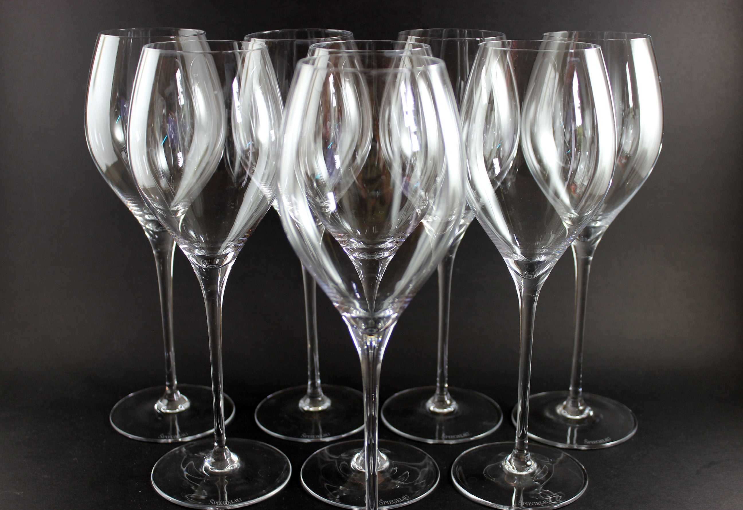 Set of clear wine glasses a dark background