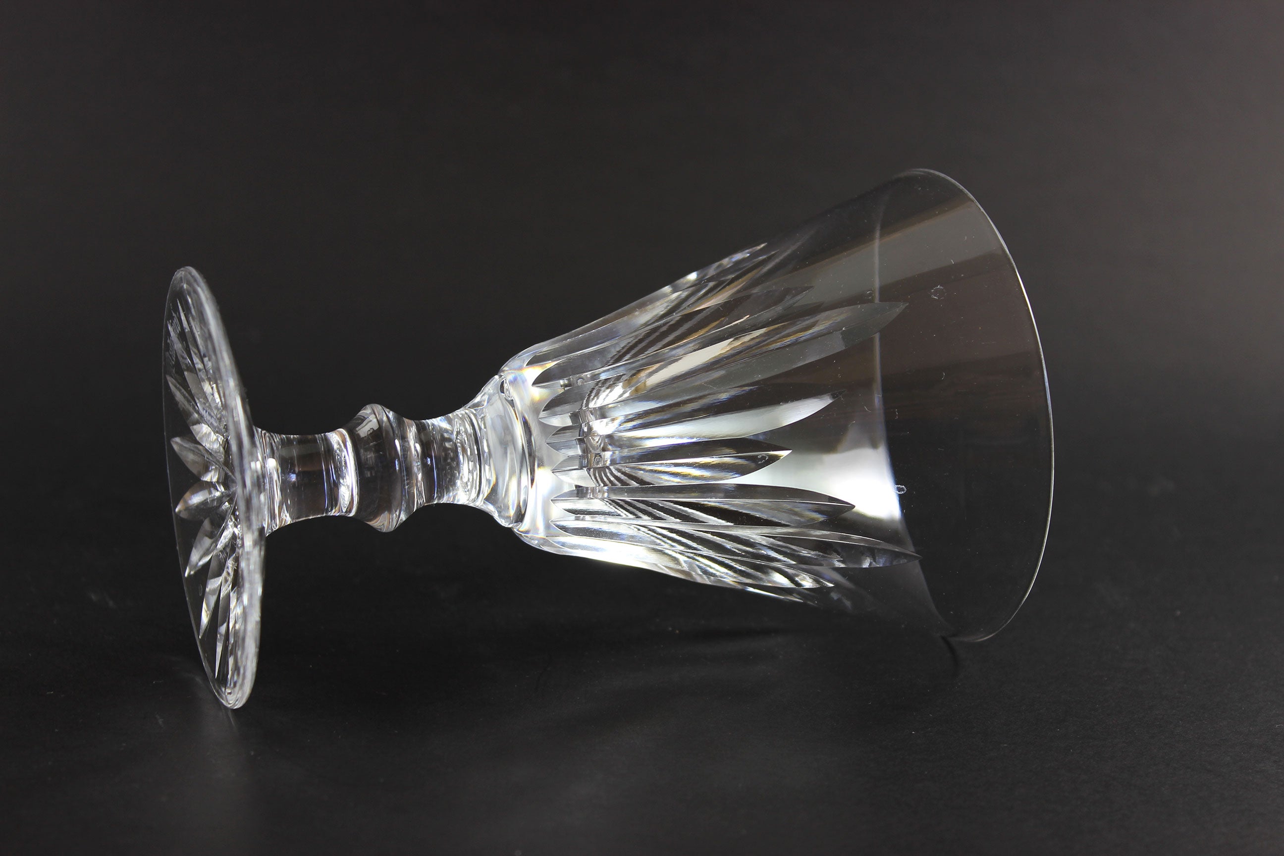 Cut crystal goblet on a black background