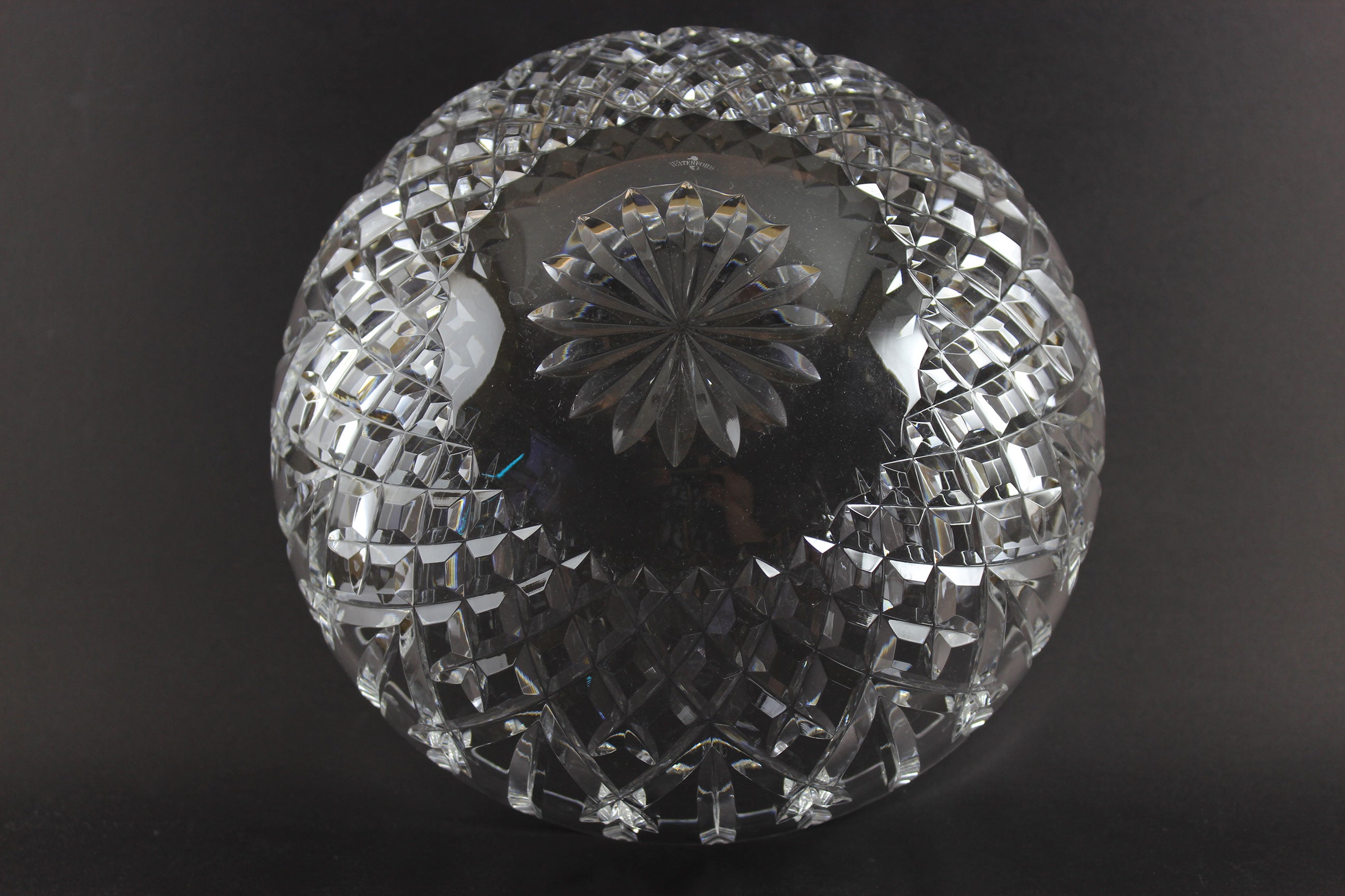 Waterford cut crystal bowl with intricate designs on a black background