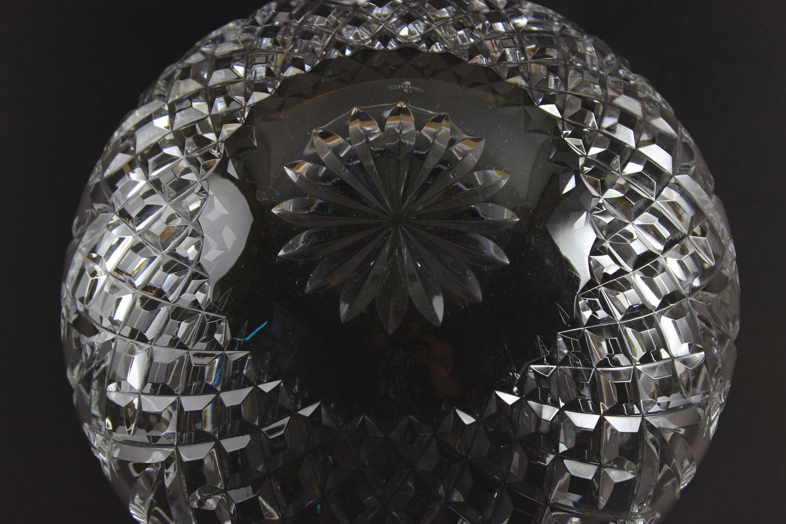 Waterford cut crystal bowl with intricate designs on a black background