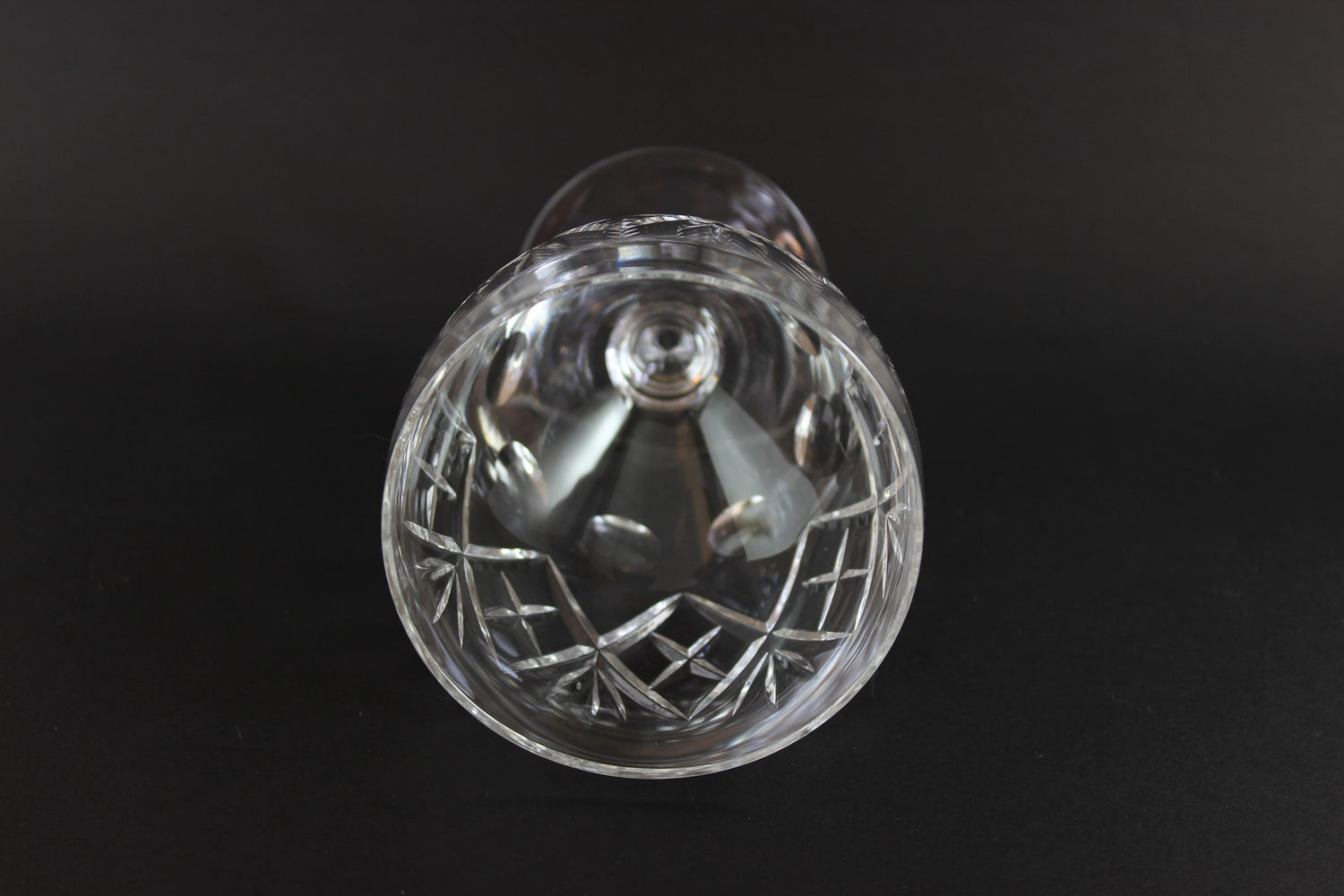 Clear crystal water goblet on a black background