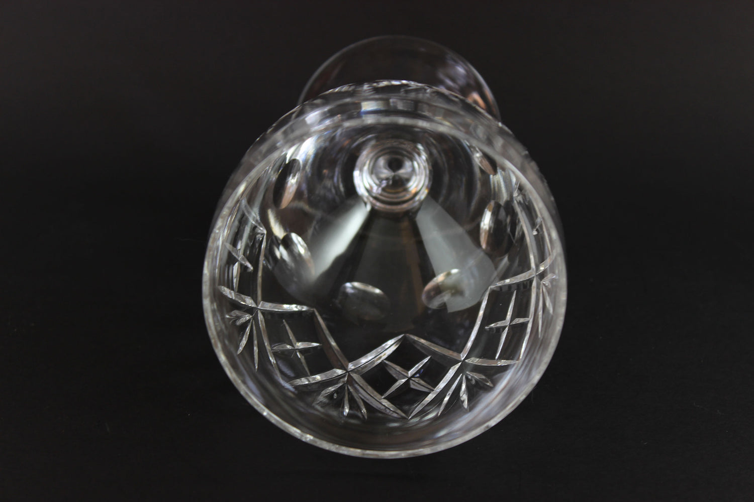 Clear crystal water goblet on a black background