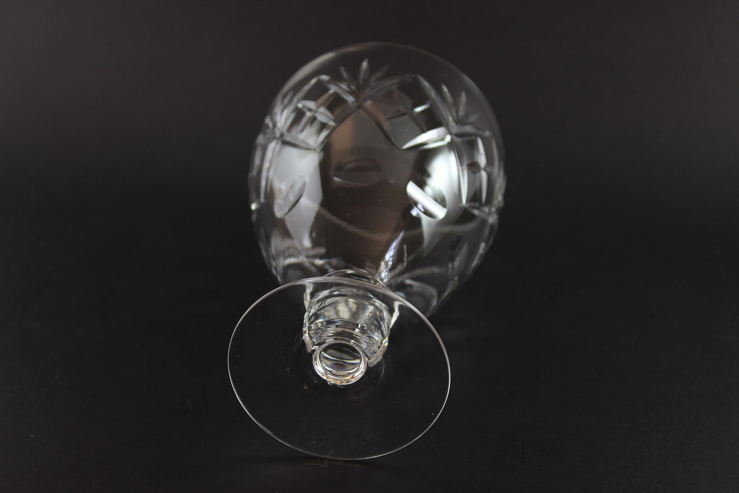 Clear glass goblet on a black background