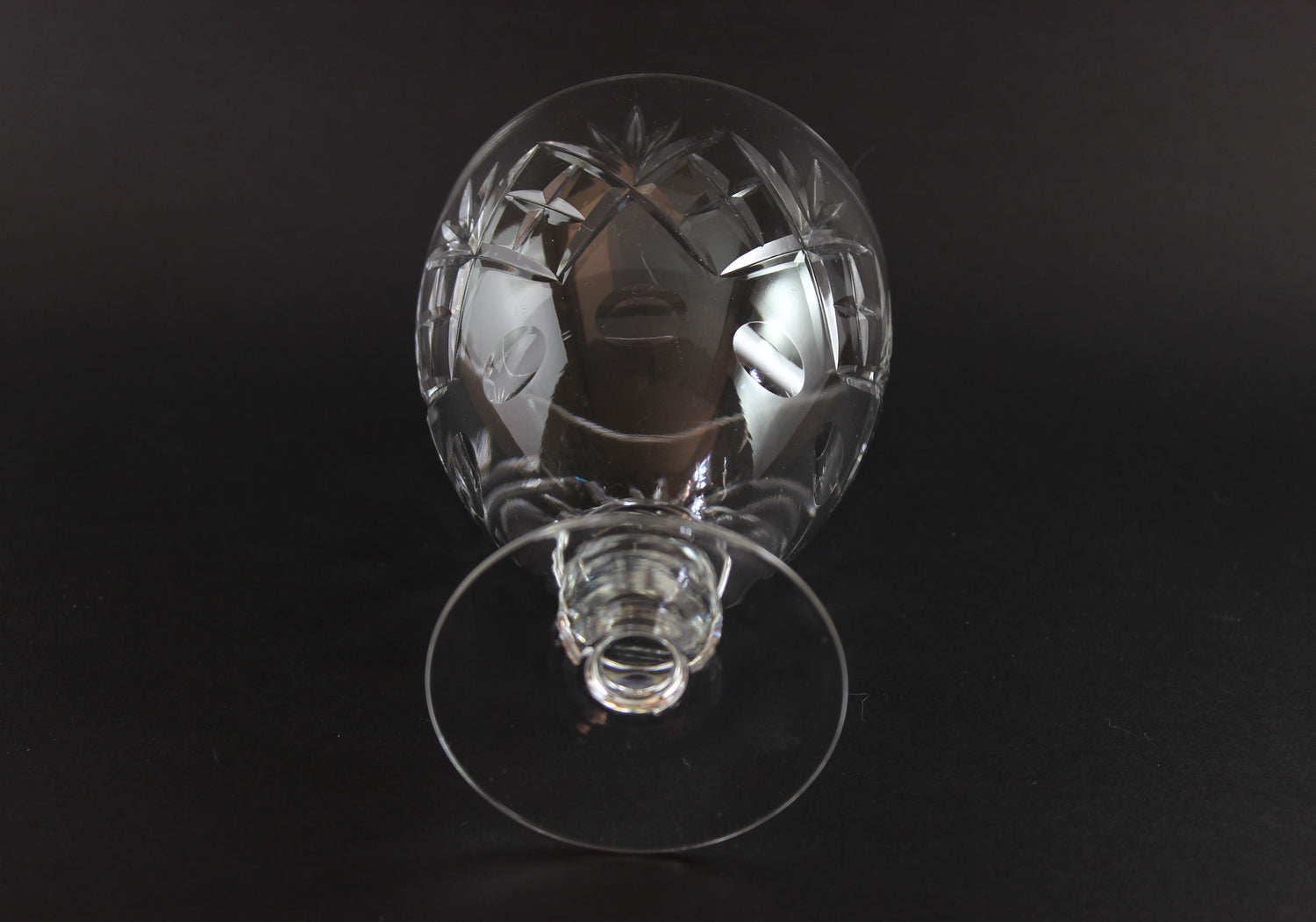 Clear crystal water goblet on a black background