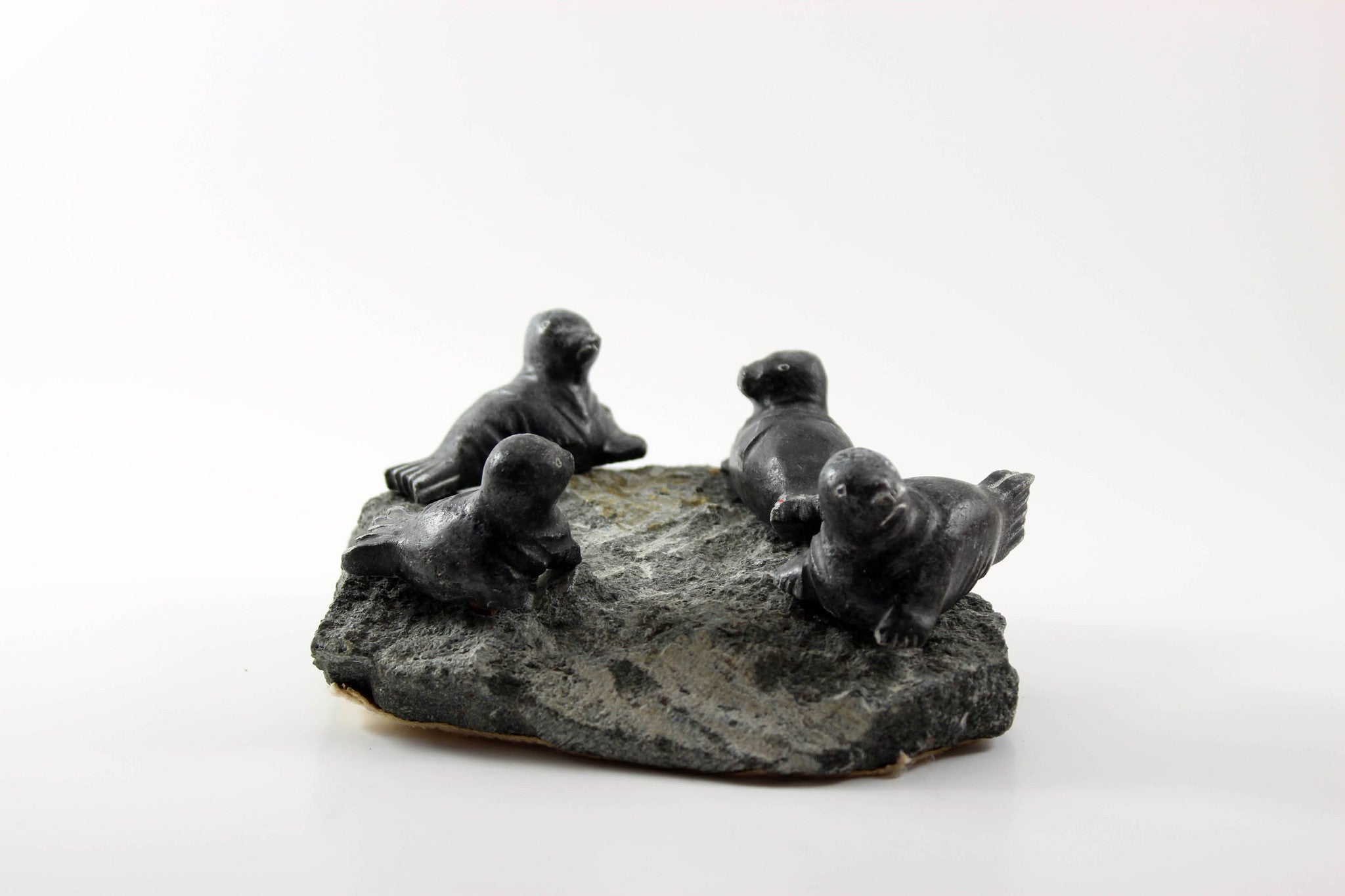 Inuit Soapstone Sculpture-Four Seals on Rock