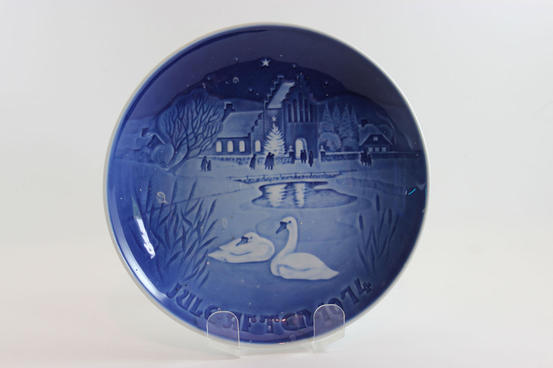 Bing and Grondahl Decorative blue plate 1974 with a winter scene featuring swans and a building.