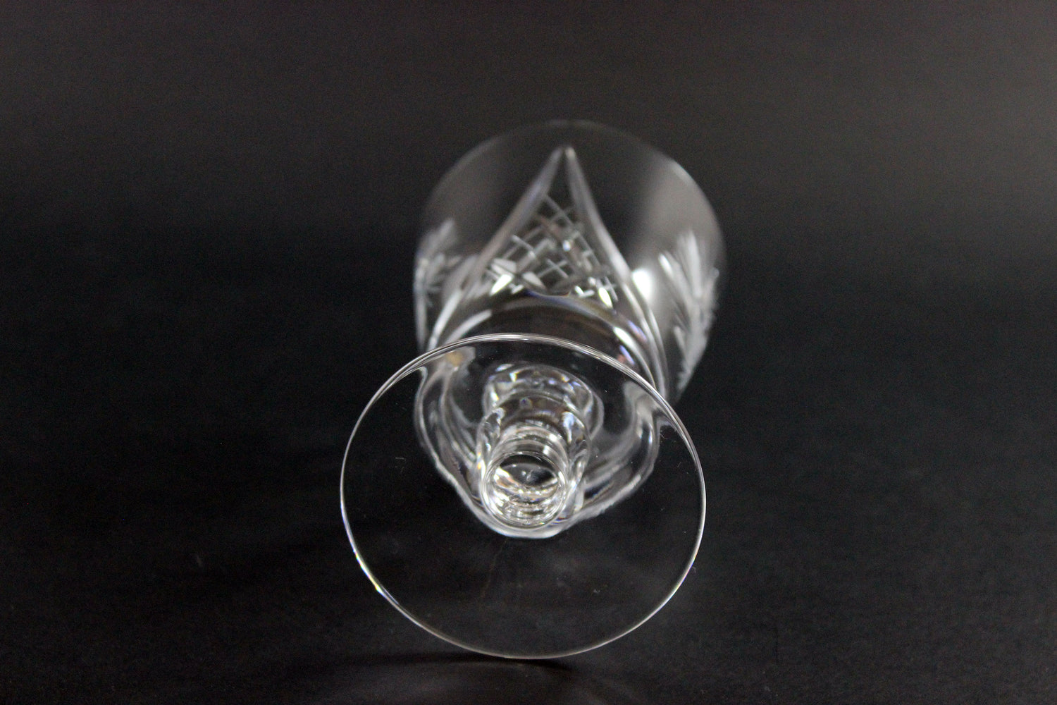 Clear crystal wine glass on a black background