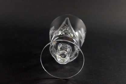 Clear crystal wine glass on a black background