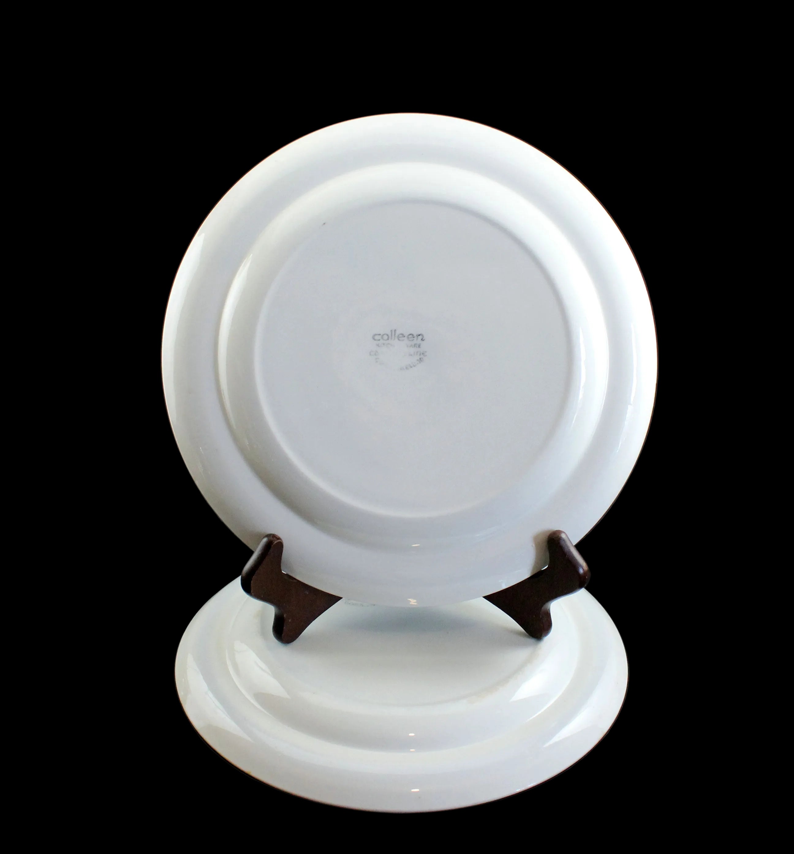 White ceramic plate on a stand with &