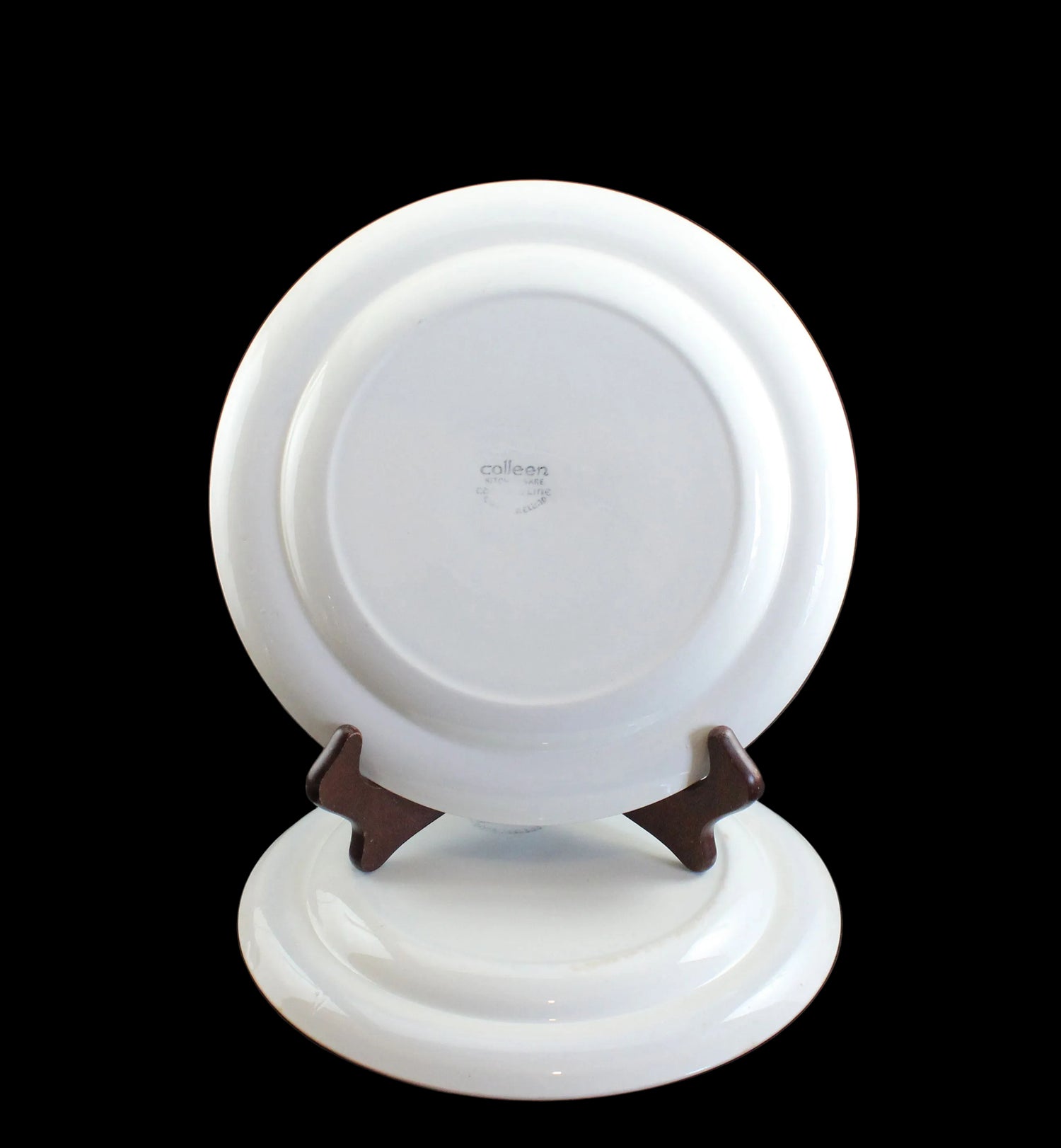 White ceramic plate on a black background